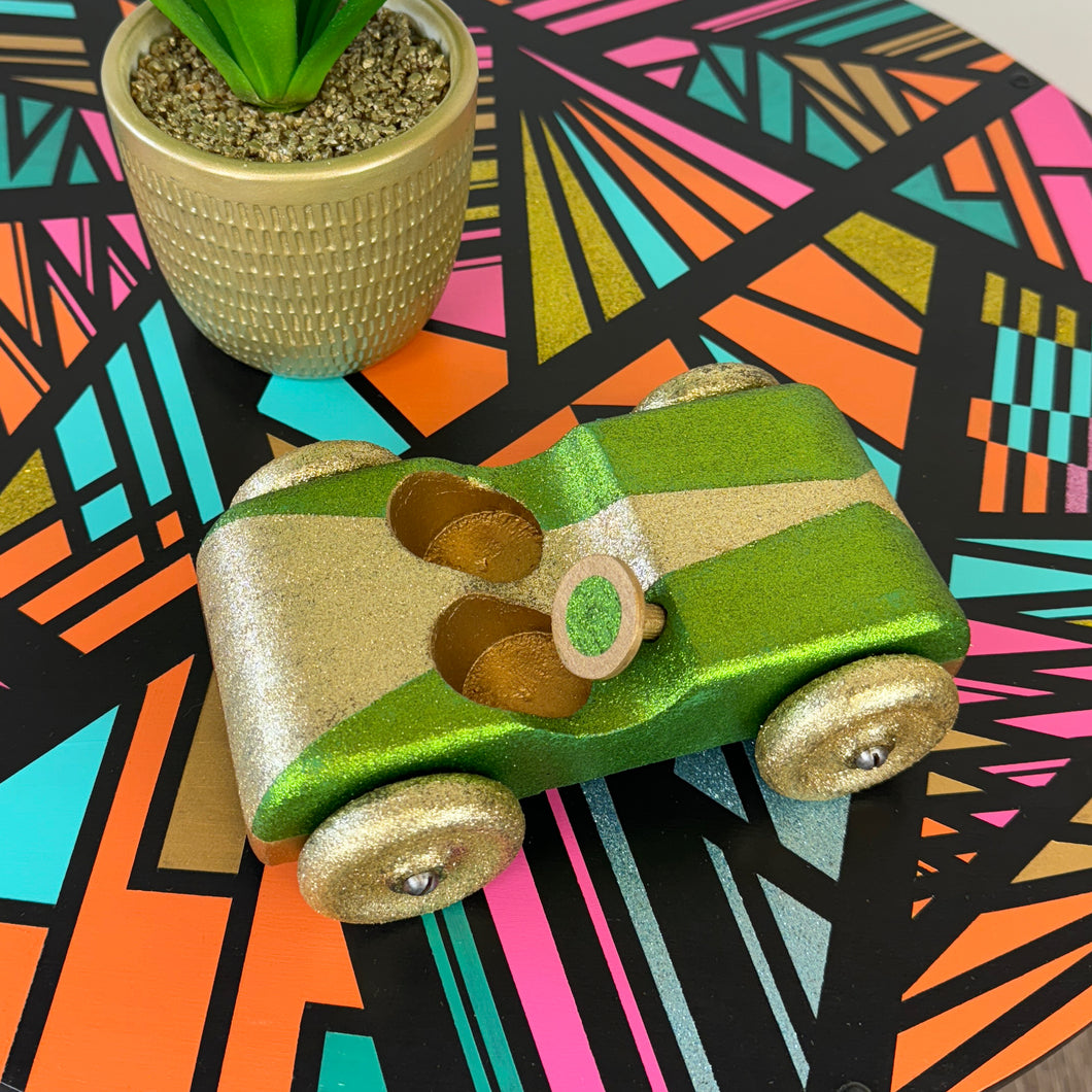 handpainted wooden toy car with green and gold glitter upcycled