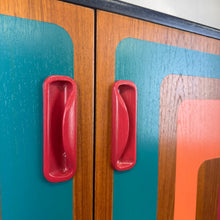 Load image into Gallery viewer, G plan cabinet handles painted in raspberry paint with retro design