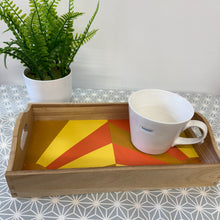 Load image into Gallery viewer, Wooden tray with a colorful geometric placemat and a white mug on a patterned surface.
