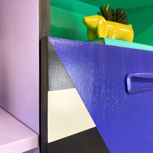 Load image into Gallery viewer, Bright yellow, blue, green, pink and lilac painted mid century storage unit with black and white striped detail