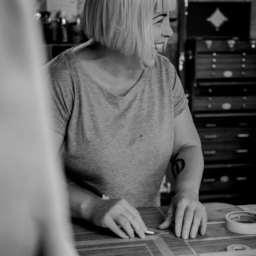 Amy from Pinkyswifts showing tape design on a piece of furniture