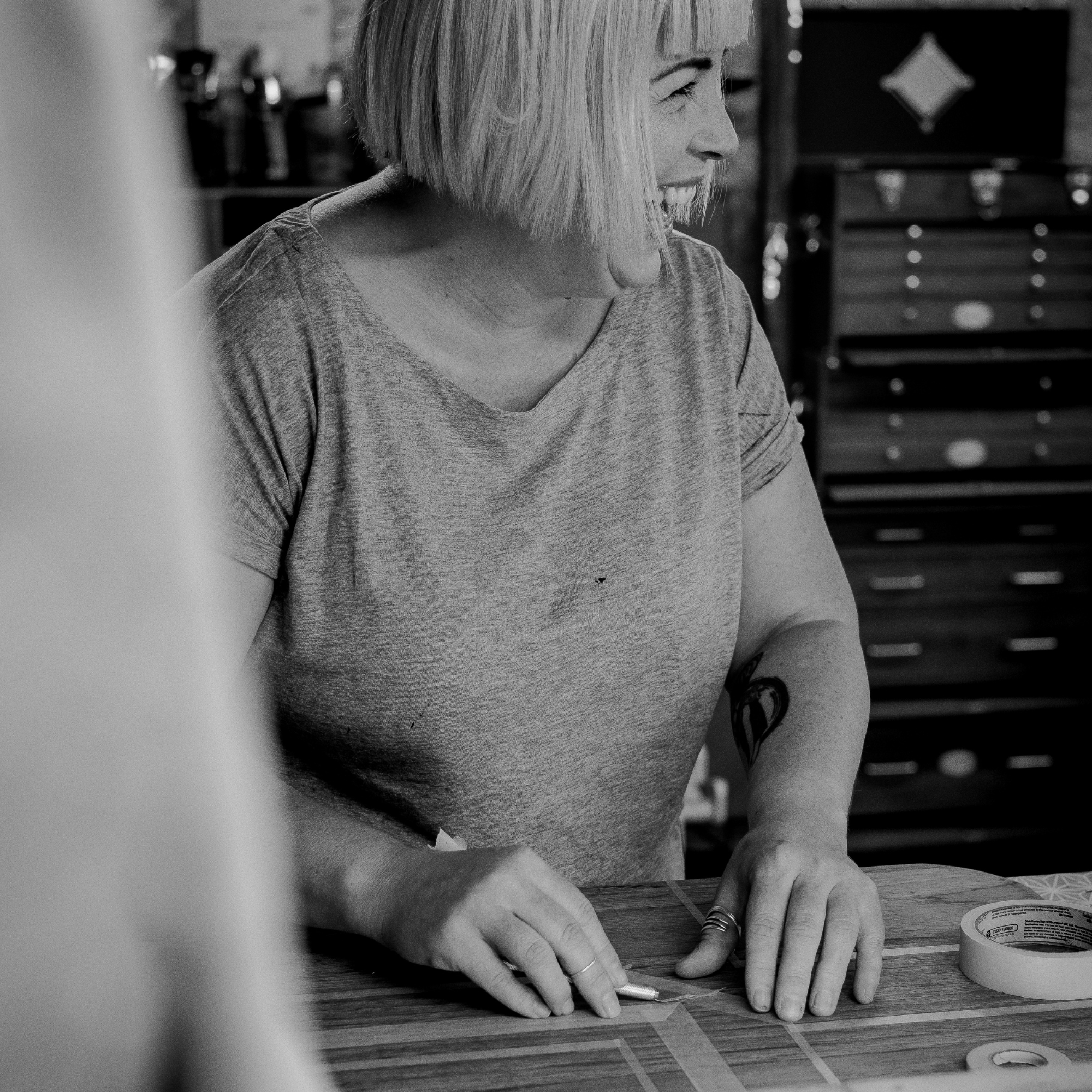 Amy from Pinkyswifts showing tape design on a piece of furniture