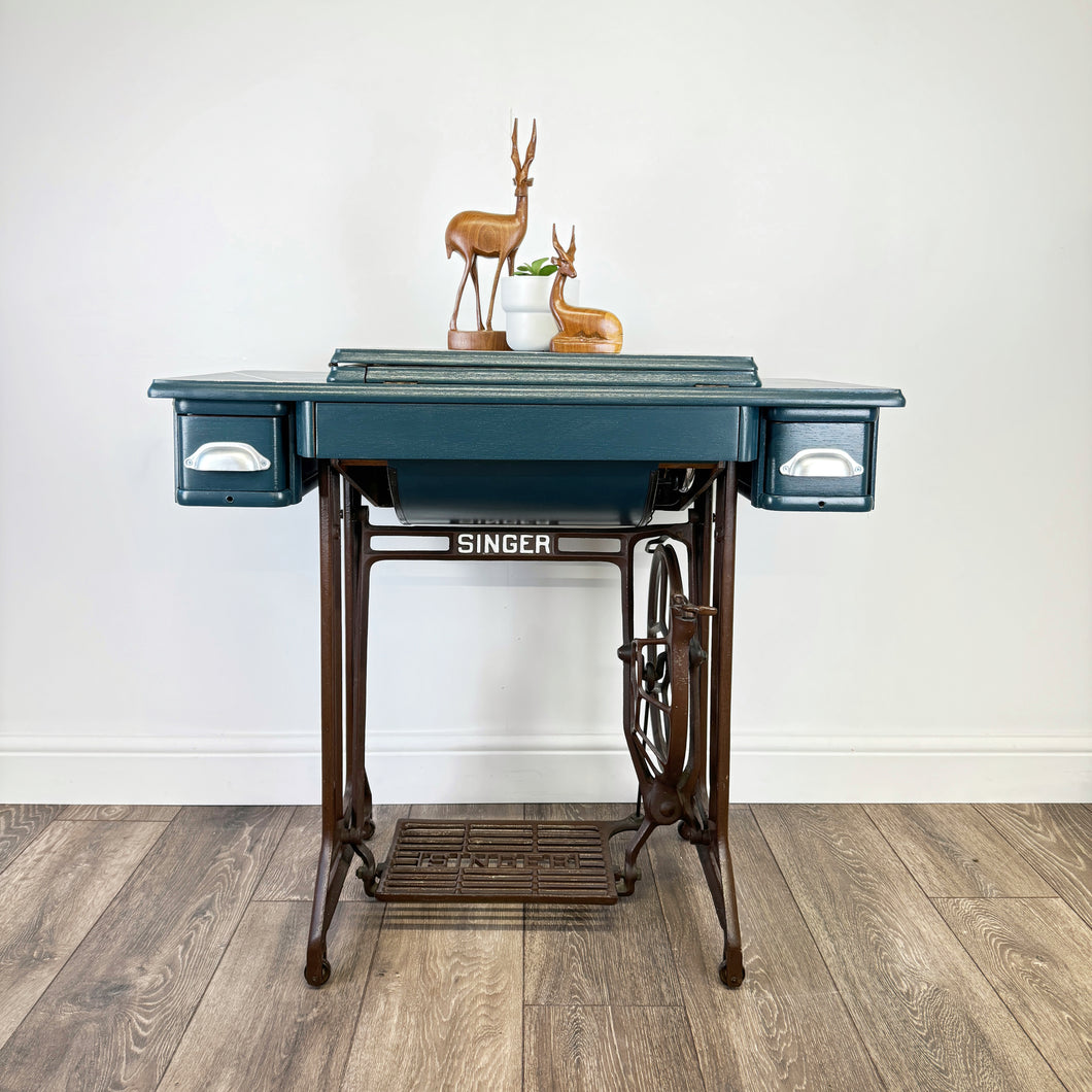 singer sewing machine table painted in blue with silver line design