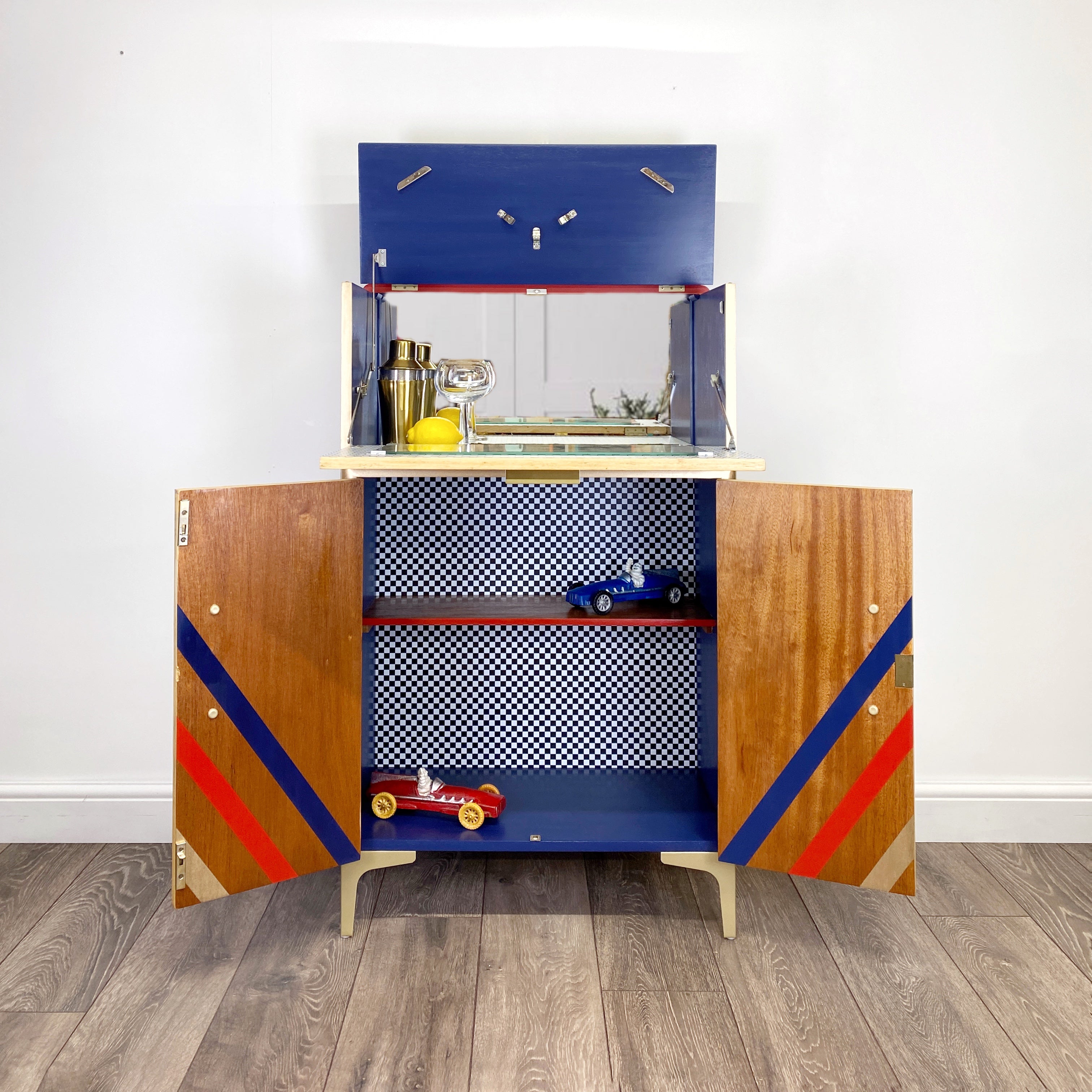 Upcycled cocktail cabinet with red, gold and blue stripes