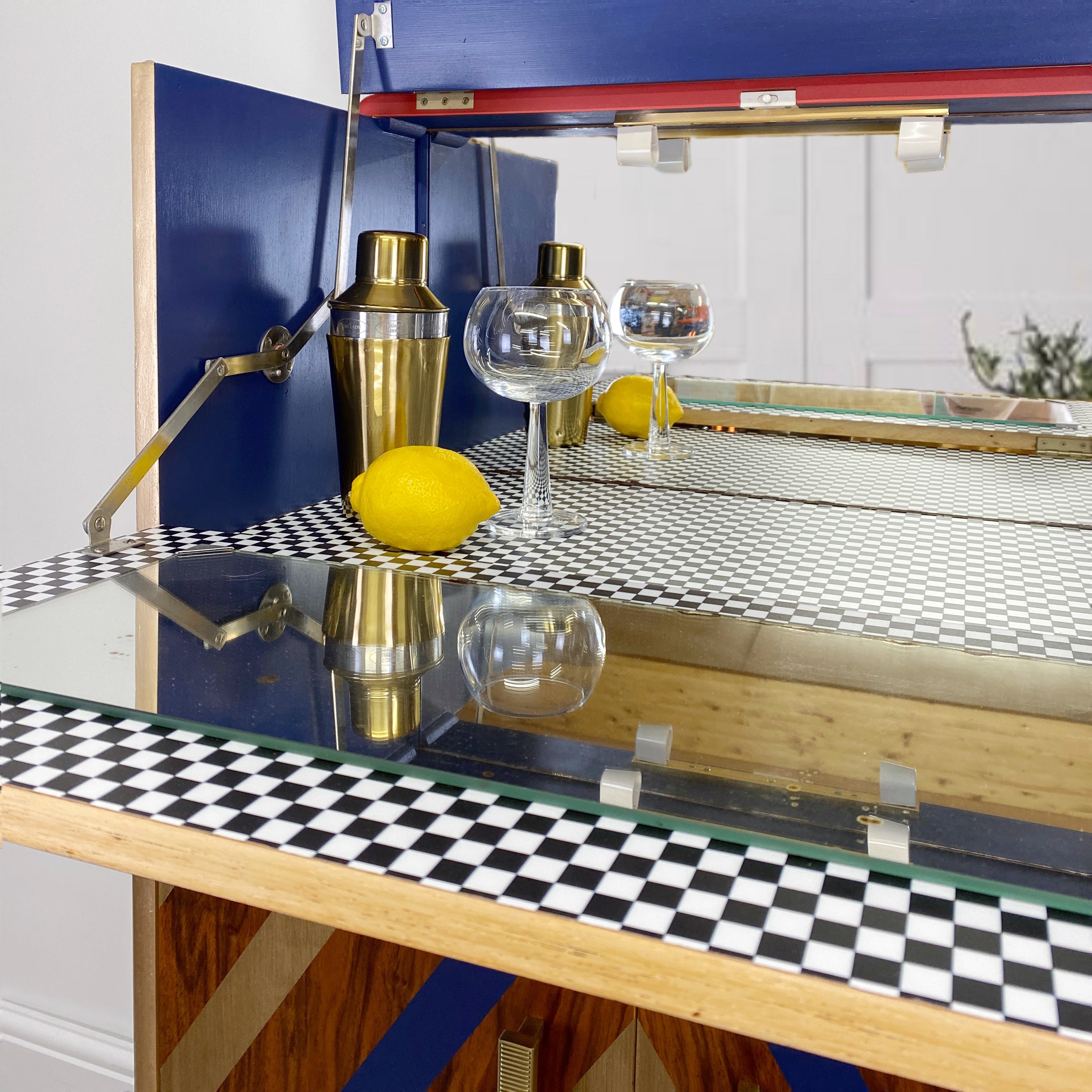 Upcycled cocktail cabinet with red, gold and blue stripes
