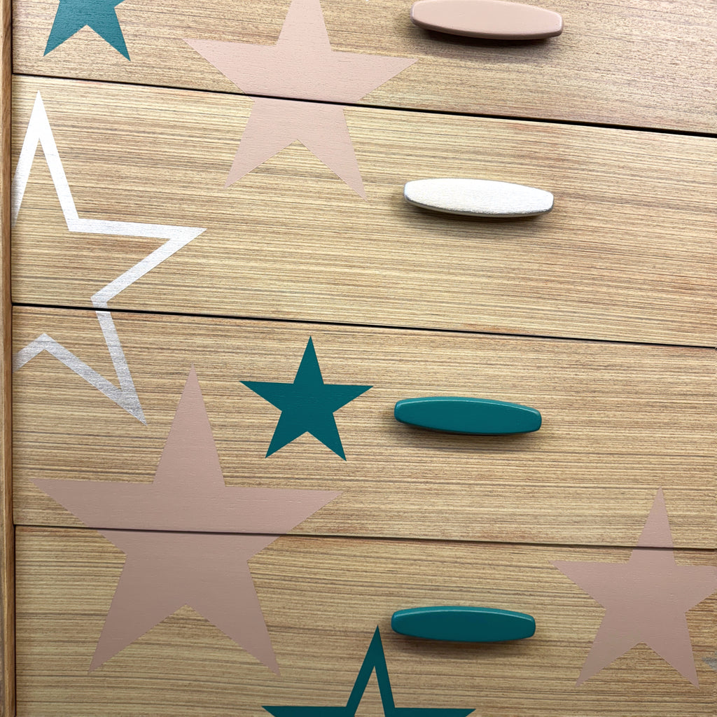 Mid century chest of drawers upcycled with pink teal and silver stars