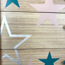 Load image into Gallery viewer, Mid century chest of drawers upcycled with pink teal and silver stars
