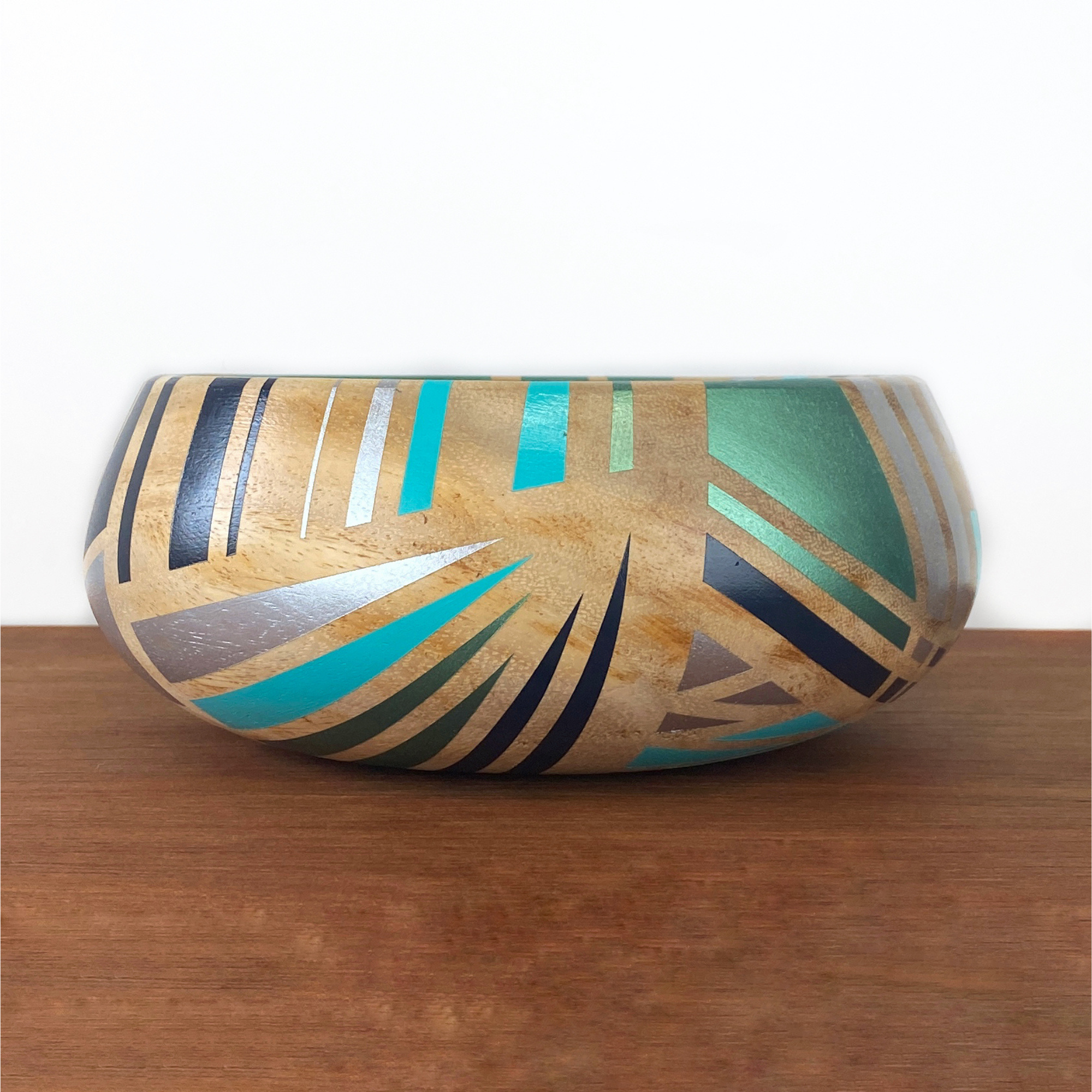 Handpainted vintage wooden bowl in a blue gold and black geometric design