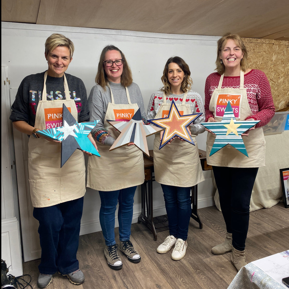 upcycled wooden christmas star handpainted by workshop students