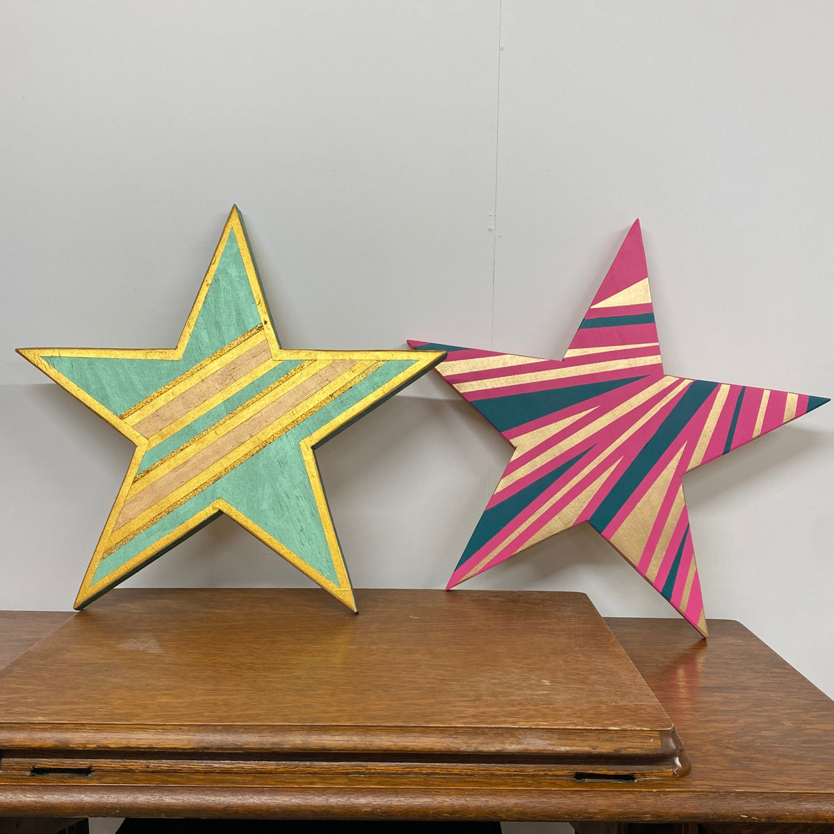 upcycled wooden christmas star handpainted by workshop students