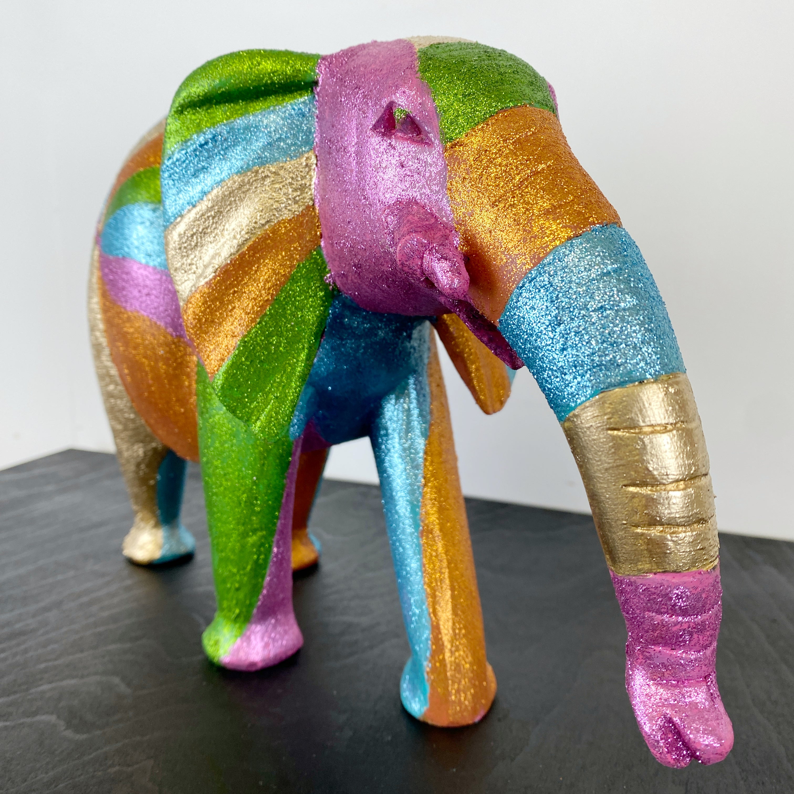 wooden elephant handpainted in glitter rainbow design