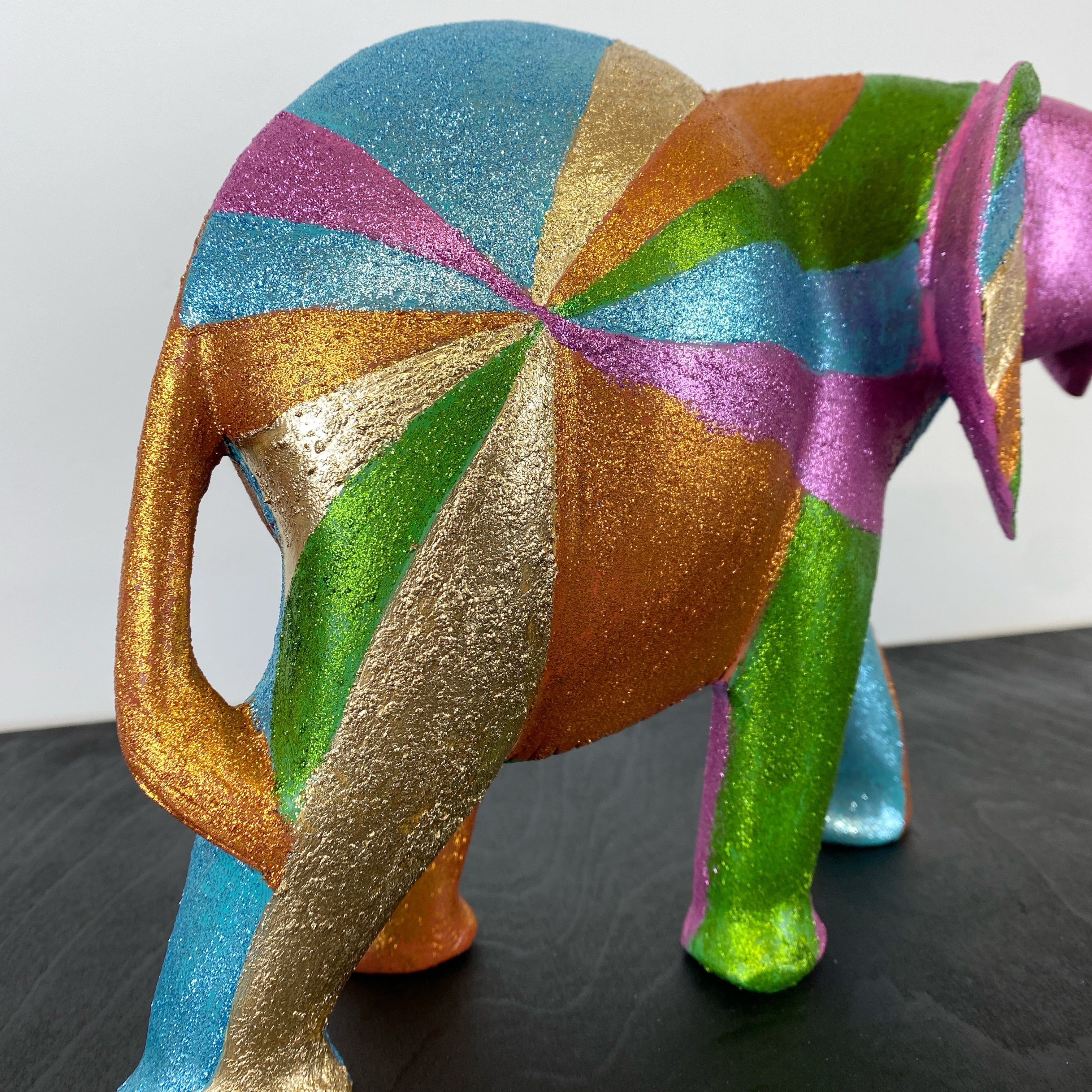 wooden elephant handpainted in glitter rainbow design