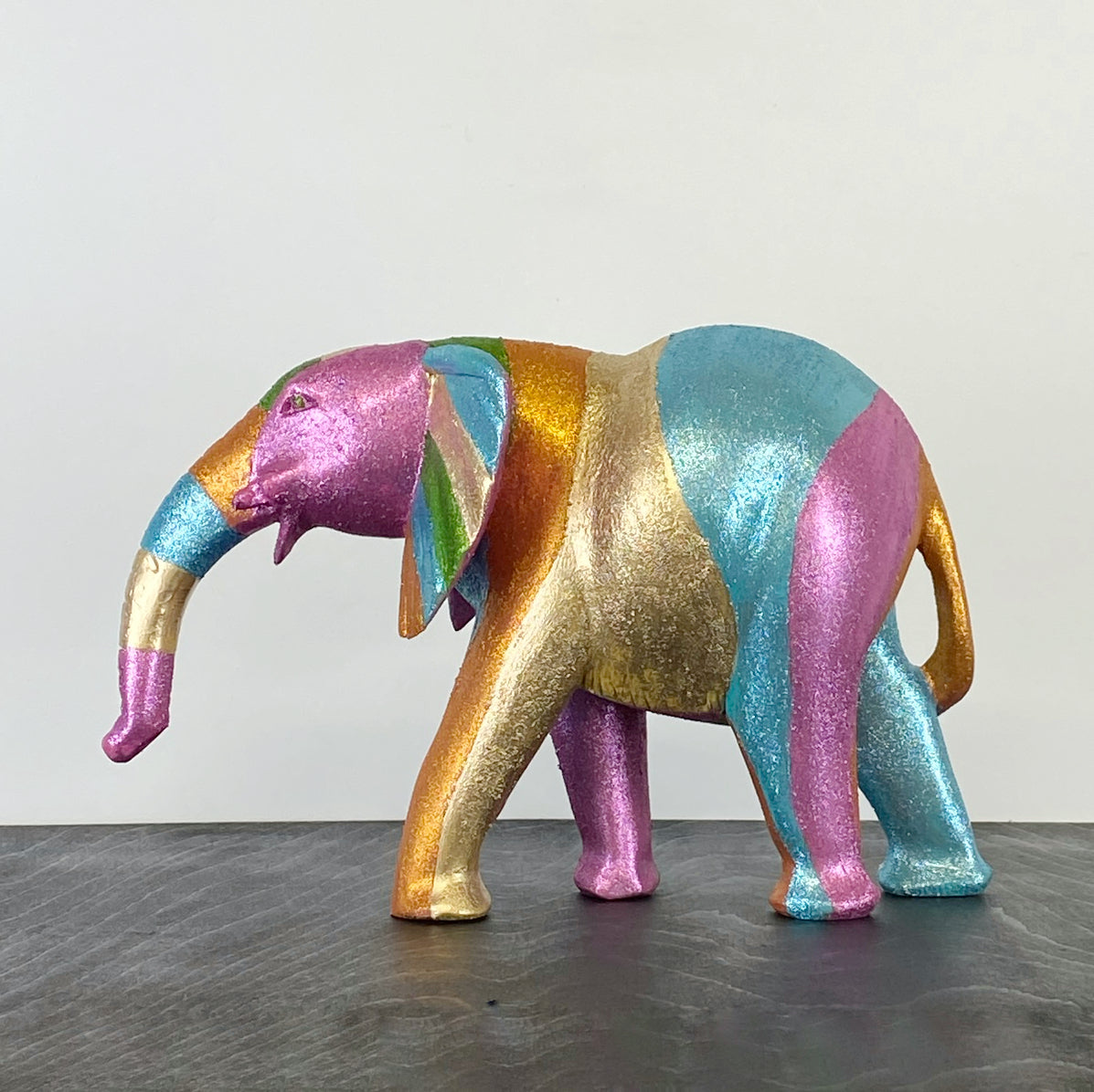 wooden elephant handpainted in glitter rainbow design