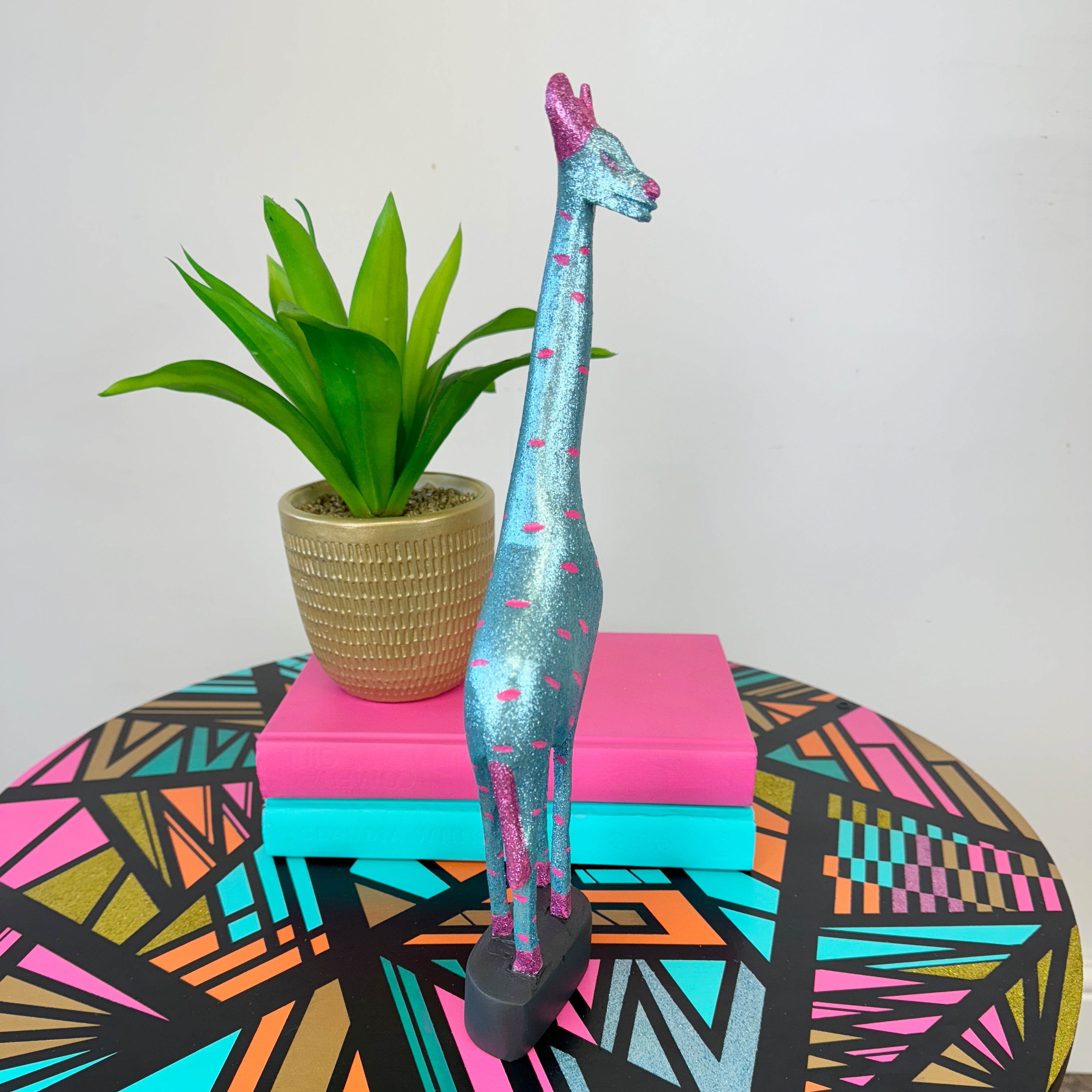 handpainted wooden giraffe in blue and pink glitter upcycled