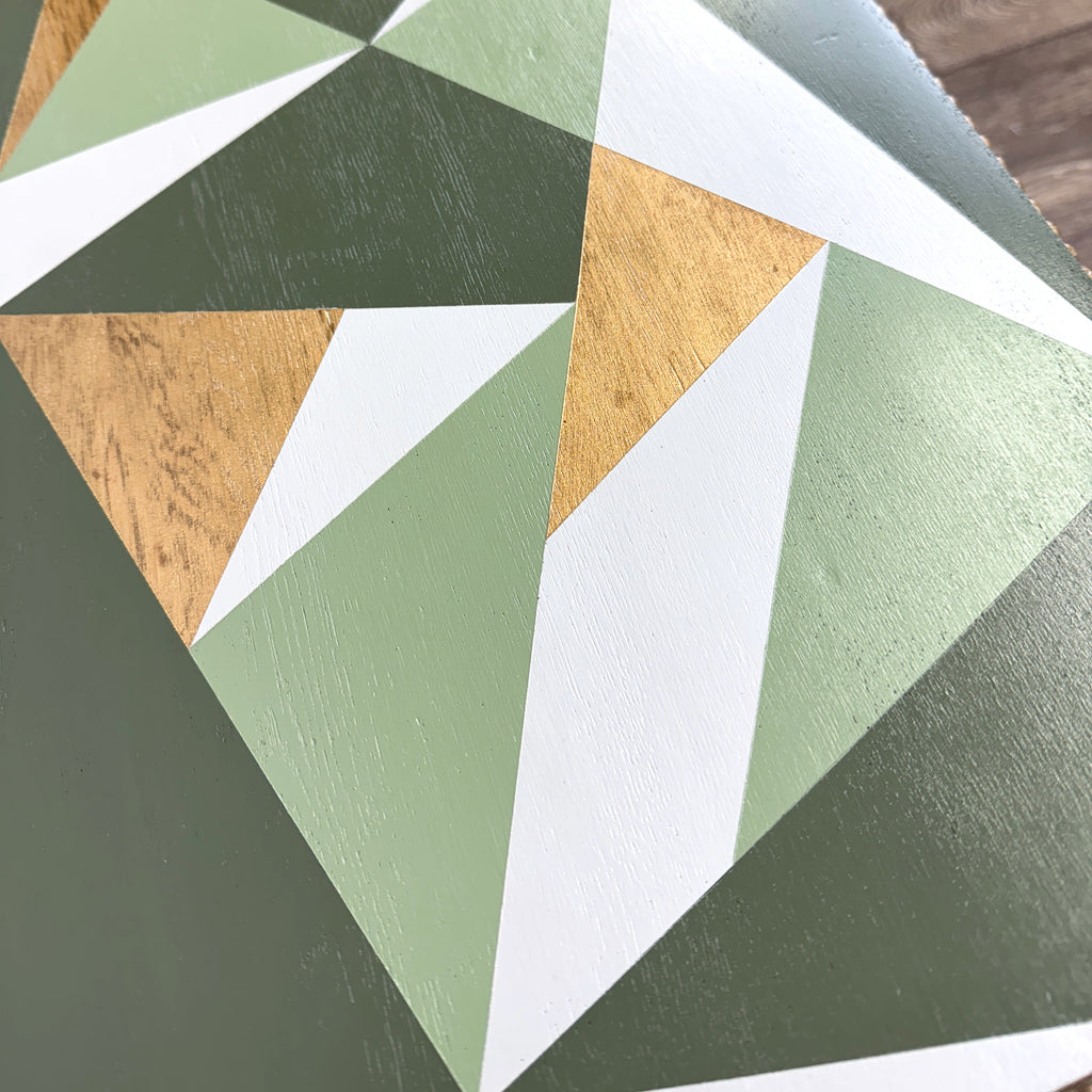 solid oak side table painted in green, grey and gold geometric design