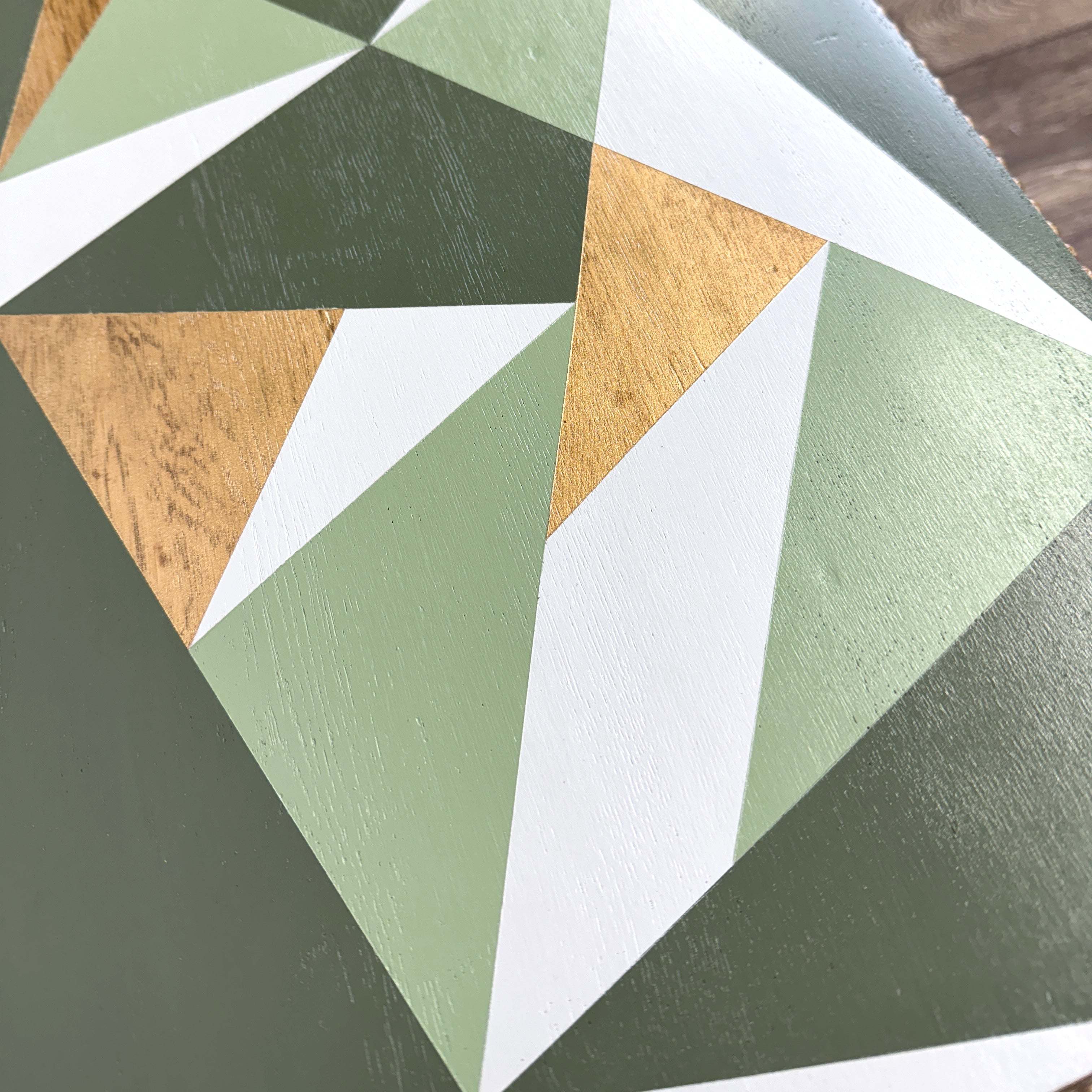 solid oak side table painted in green, grey and gold geometric design