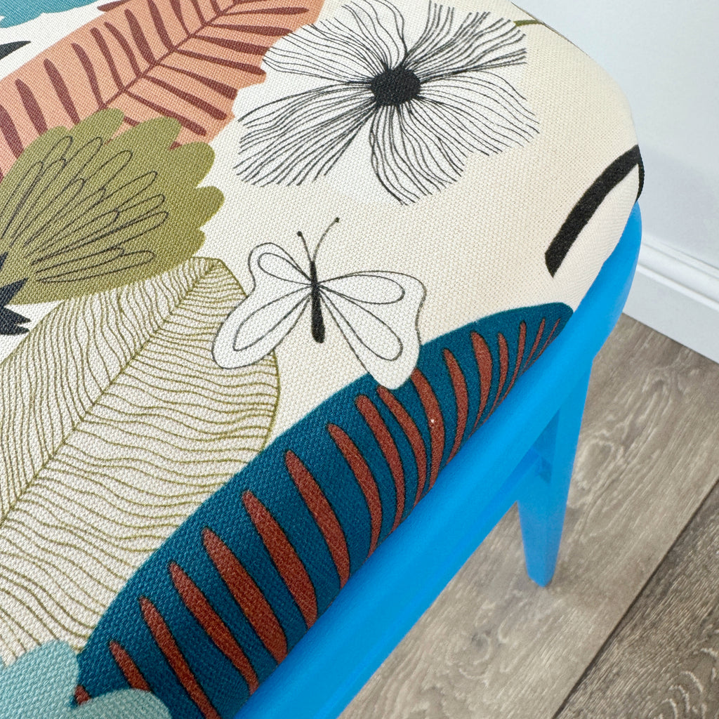 blue painted wooden stool with 1950s inspired flower fabric