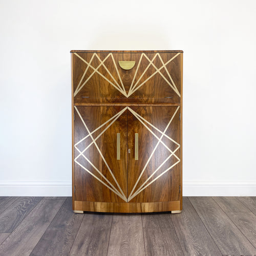 Upcycled drinks cabinet with gold line design