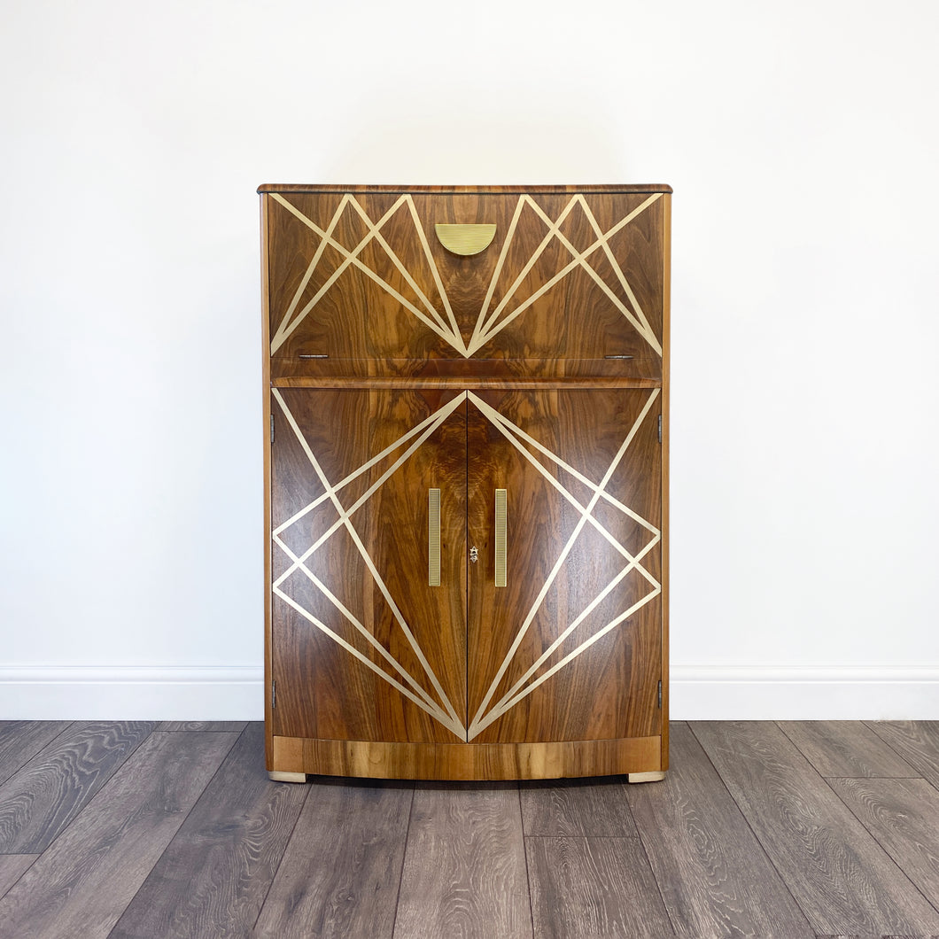 Upcycled drinks cabinet with gold line design