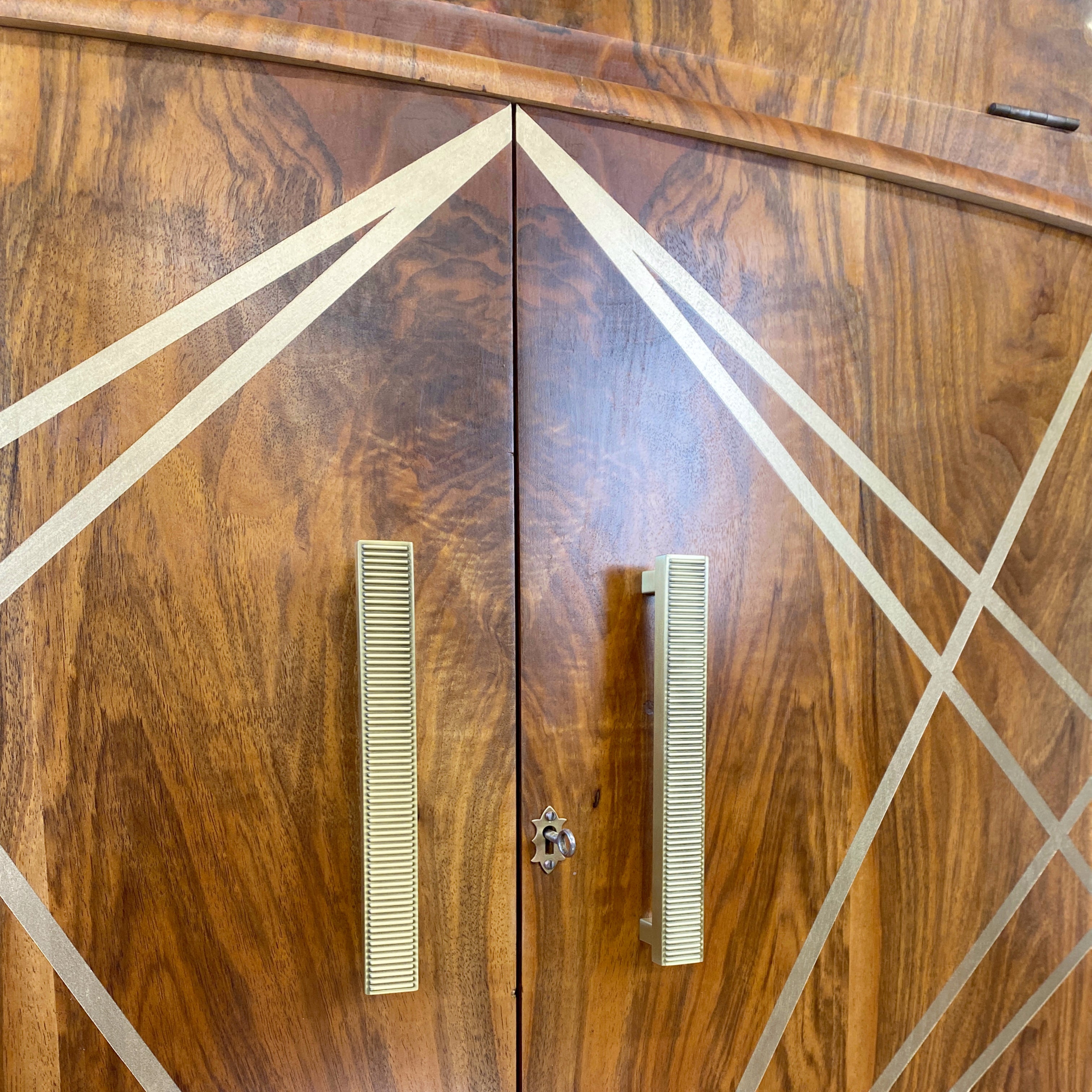 Upcycled drinks cabinet with gold line design