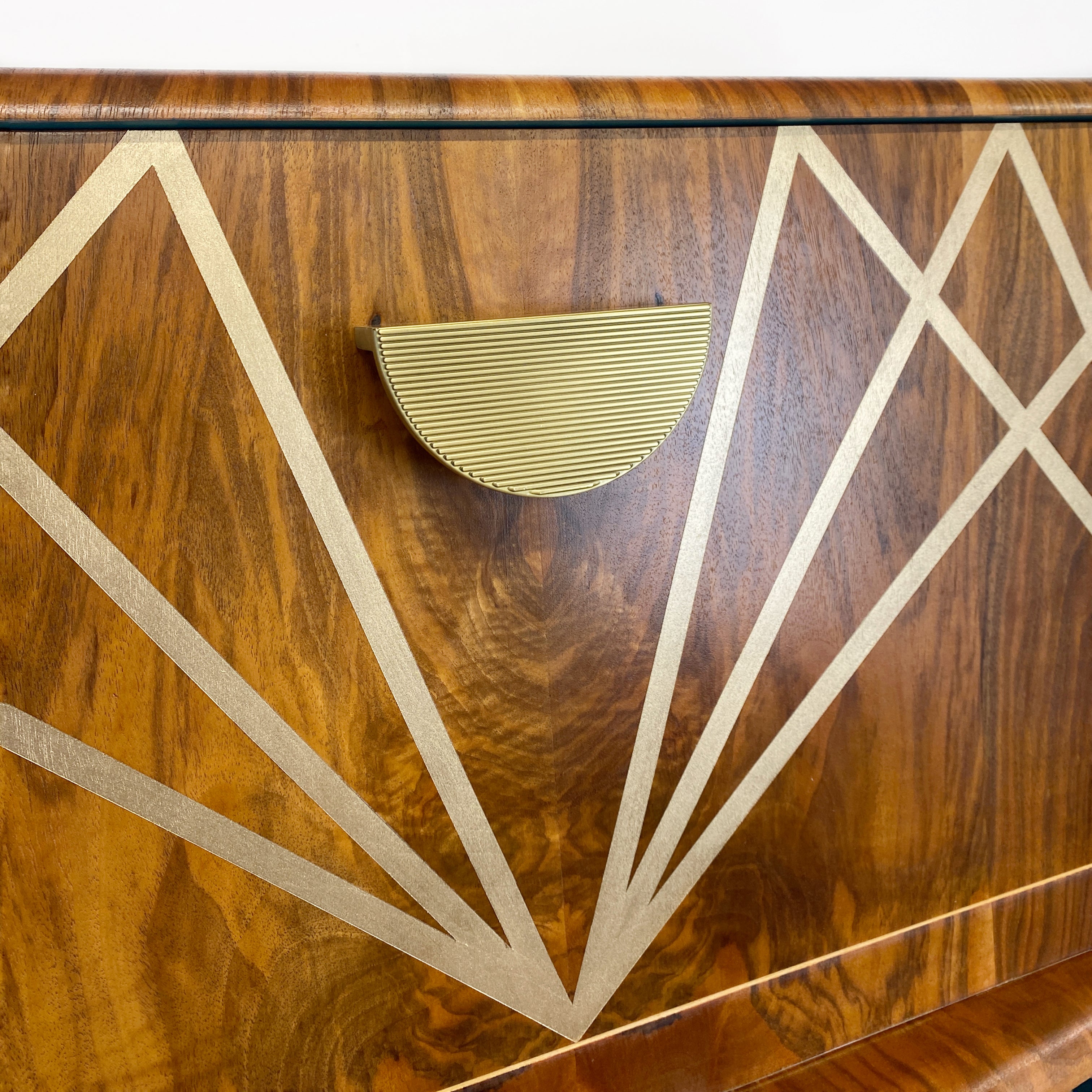 Upcycled drinks cabinet with gold line design