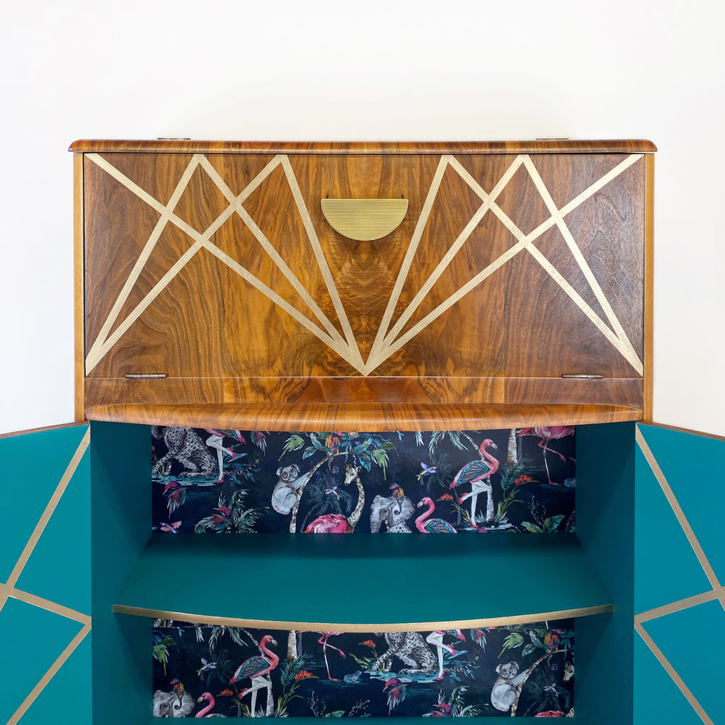 Upcycled drinks cabinet with gold line design