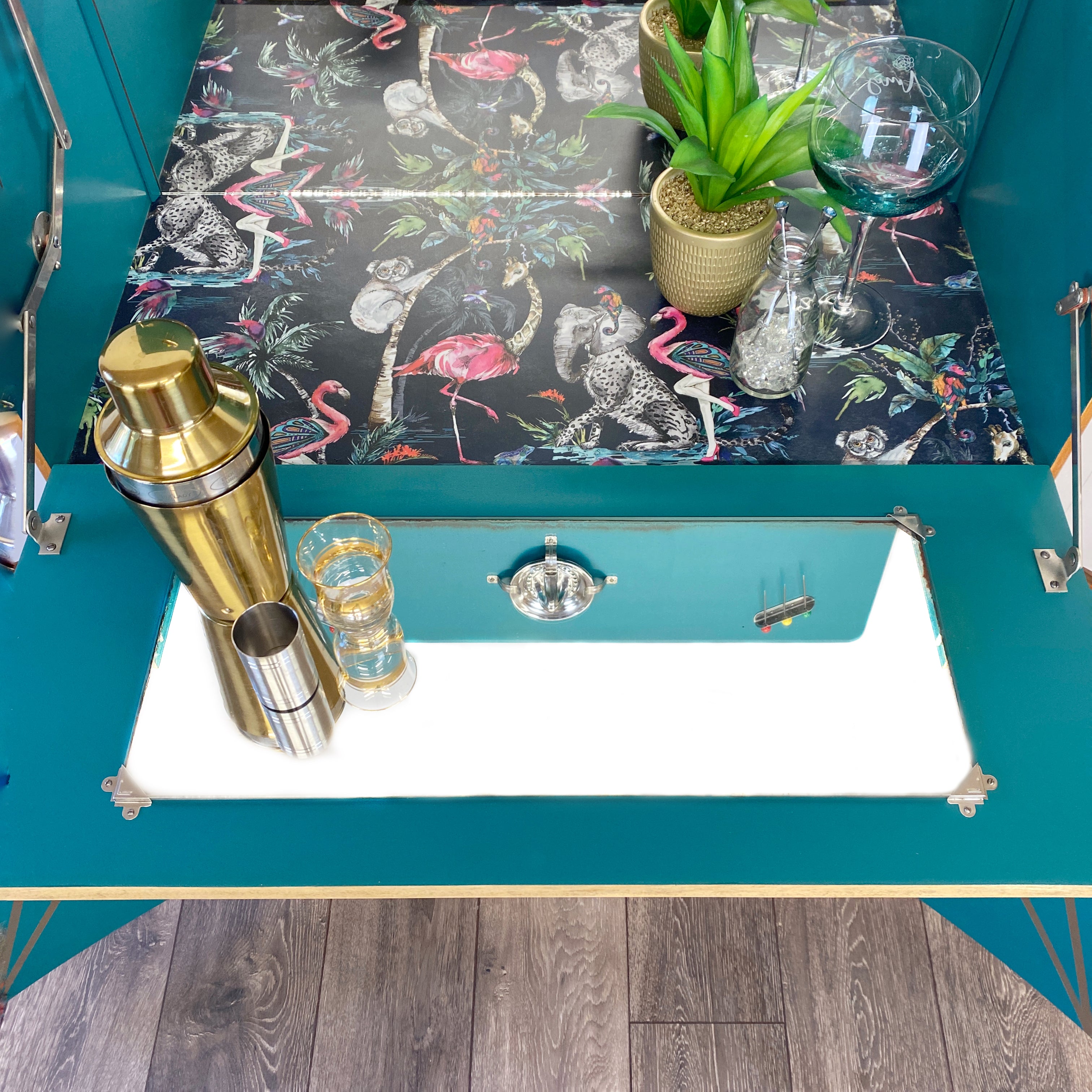 Upcycled drinks cabinet with gold line design