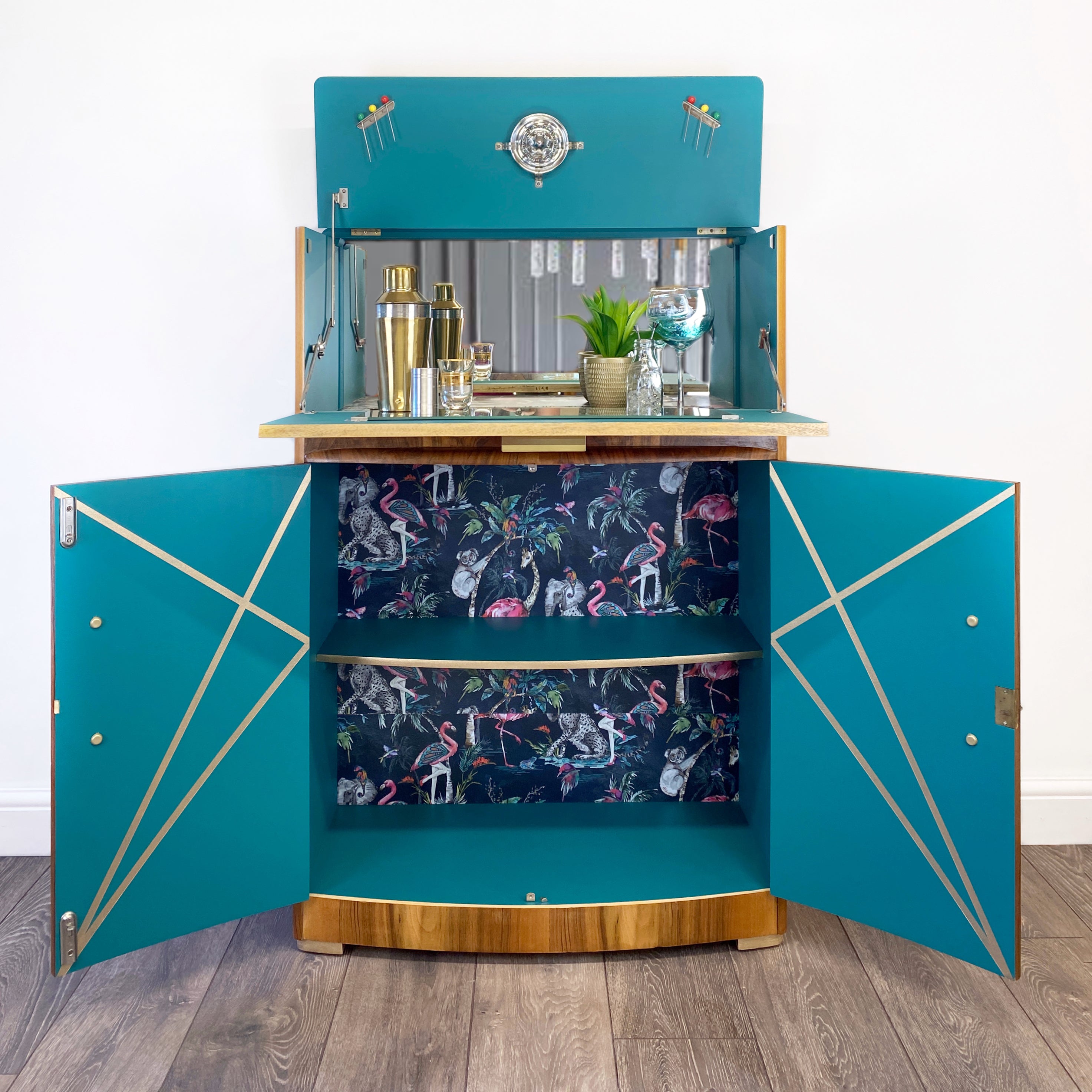 Upcycled drinks cabinet with gold line design