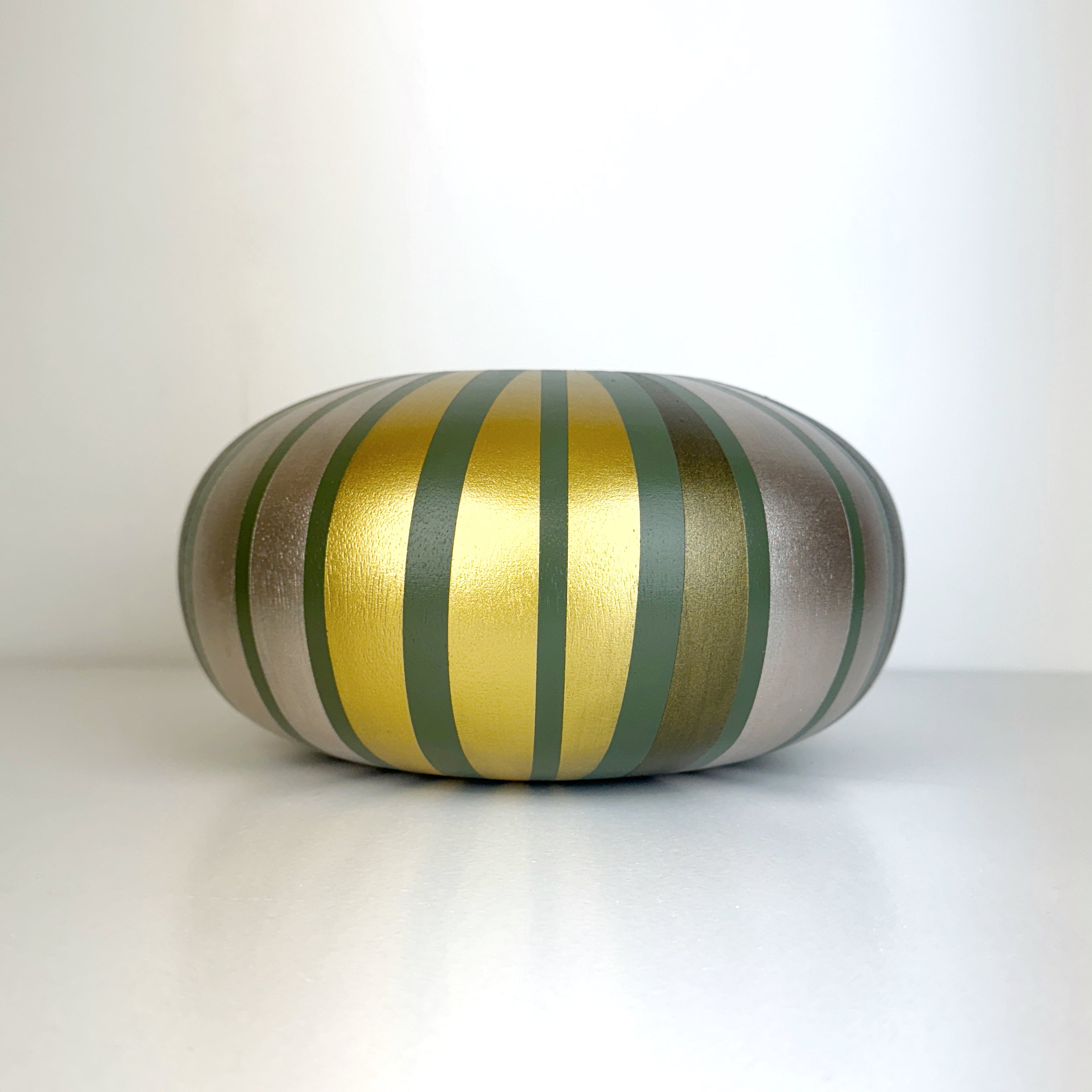 handpainted upcycled wooden bowl in sage green with gold striped design