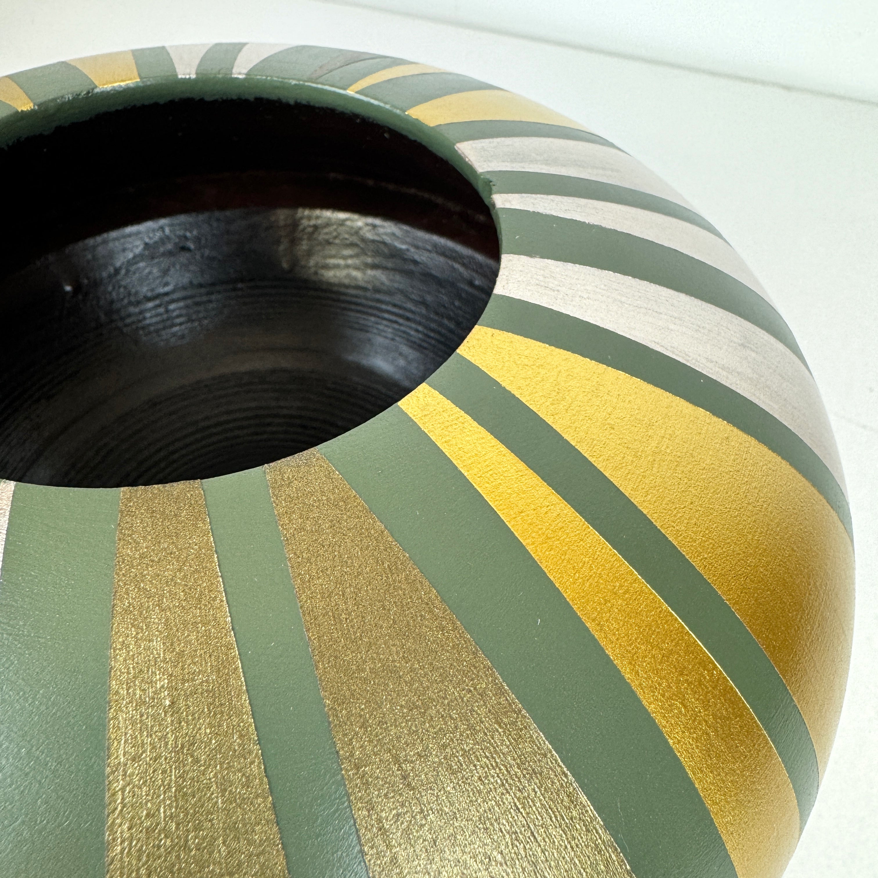 handpainted upcycled wooden bowl in sage green with gold striped design