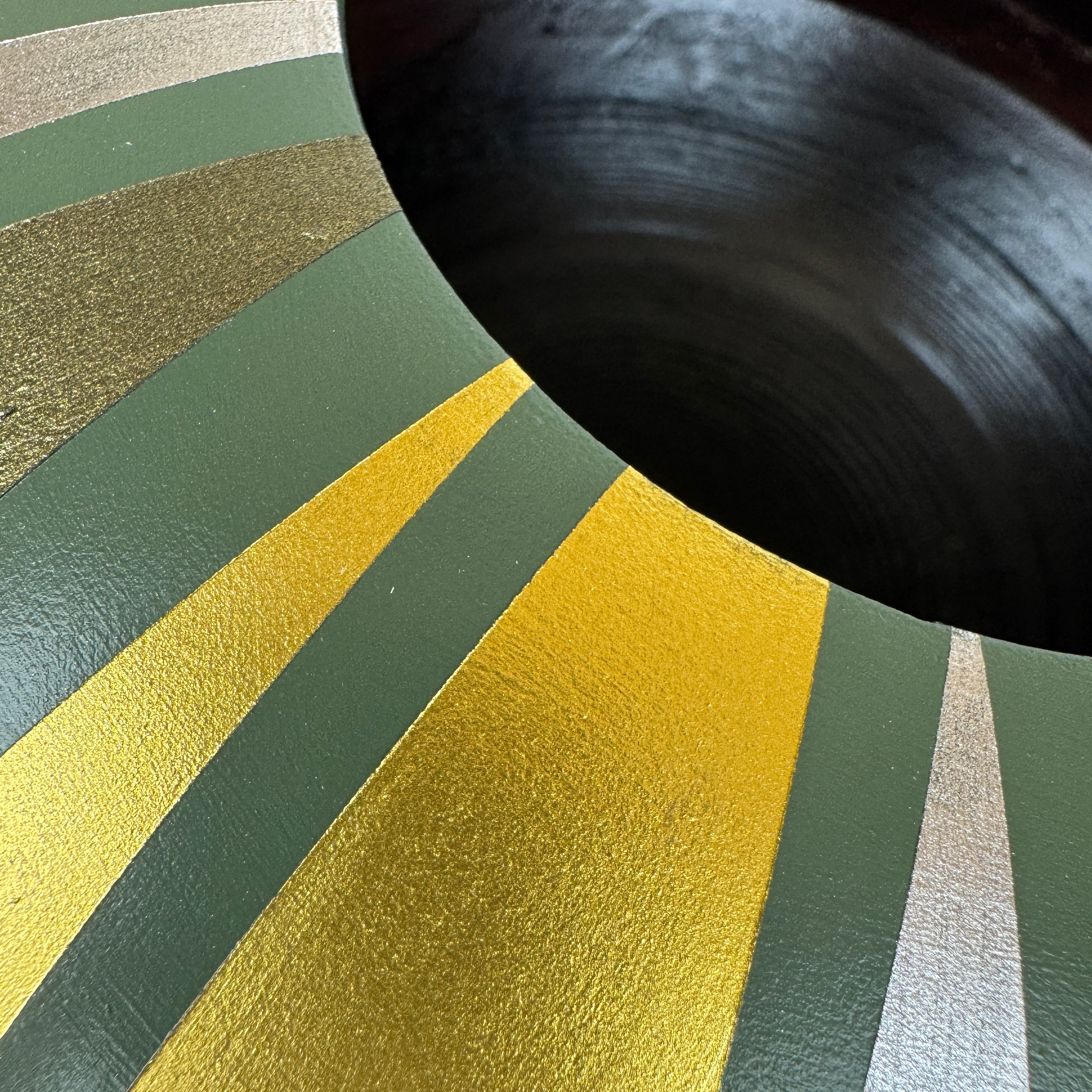 handpainted upcycled wooden bowl in sage green with gold striped design