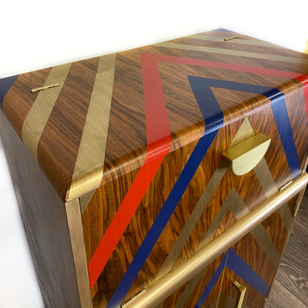 Upcycled cocktail cabinet with red, gold and blue stripes