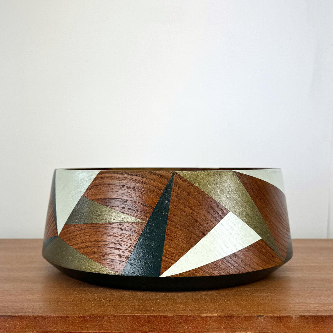 Wooden vintage bowl painted with geometric design in pale green, bronze and dark teal