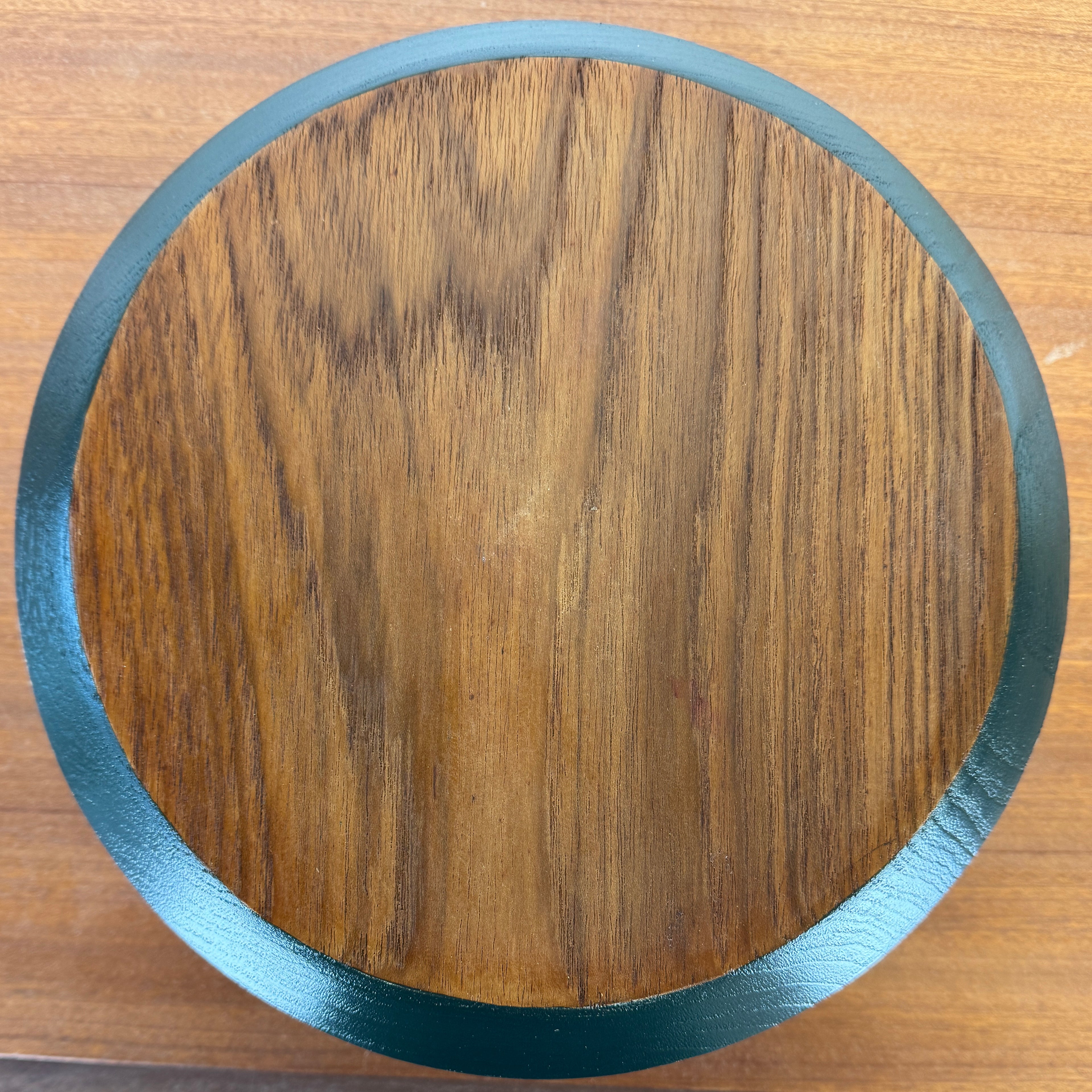 Wooden vintage bowl painted with geometric design in pale green, bronze and dark teal