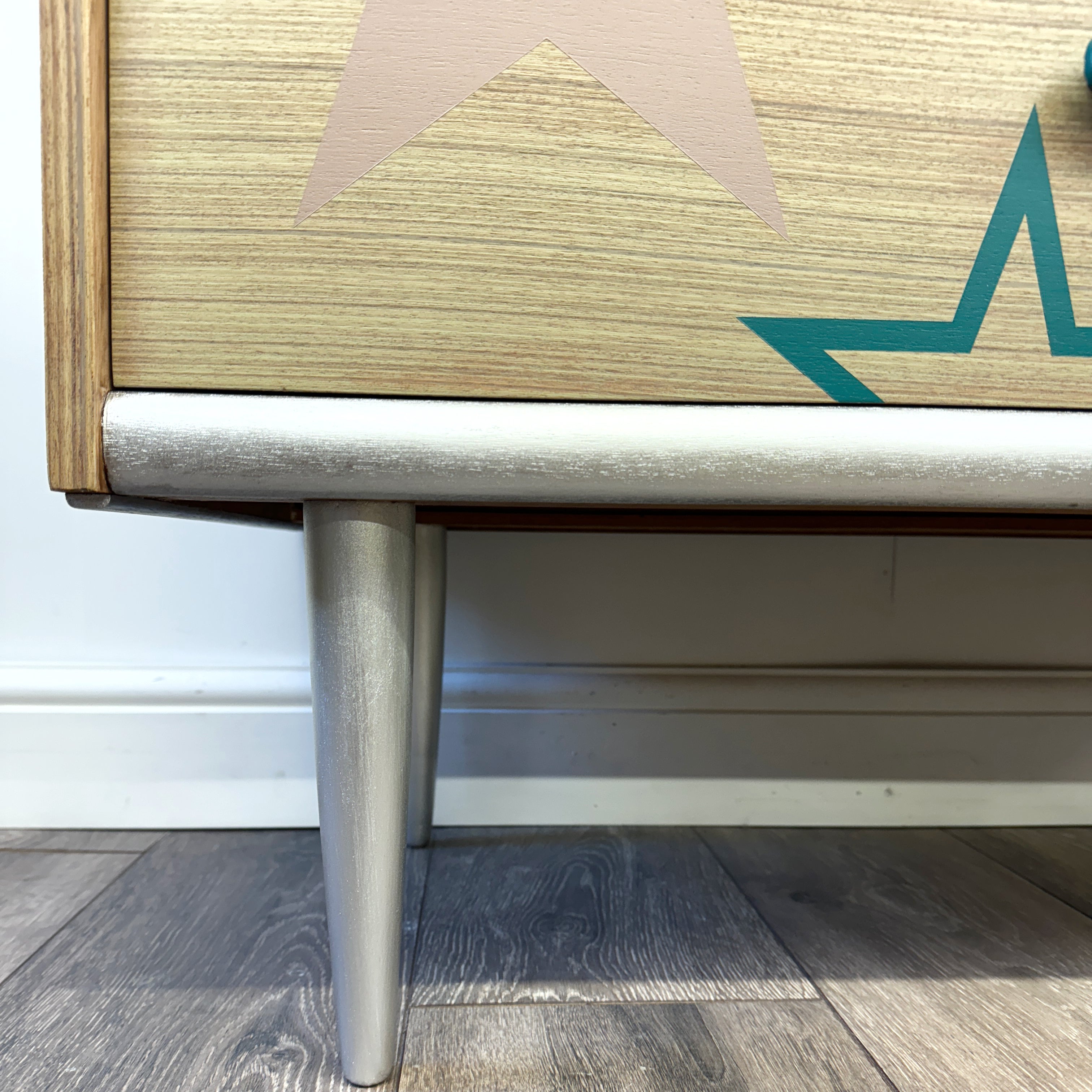 Mid century chest of drawers upcycled with pink teal and silver stars