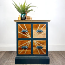 Load image into Gallery viewer, Teal and gold handpainted upcycled solid wooden drawers with gold sunburst design on the top and teal cup handles
