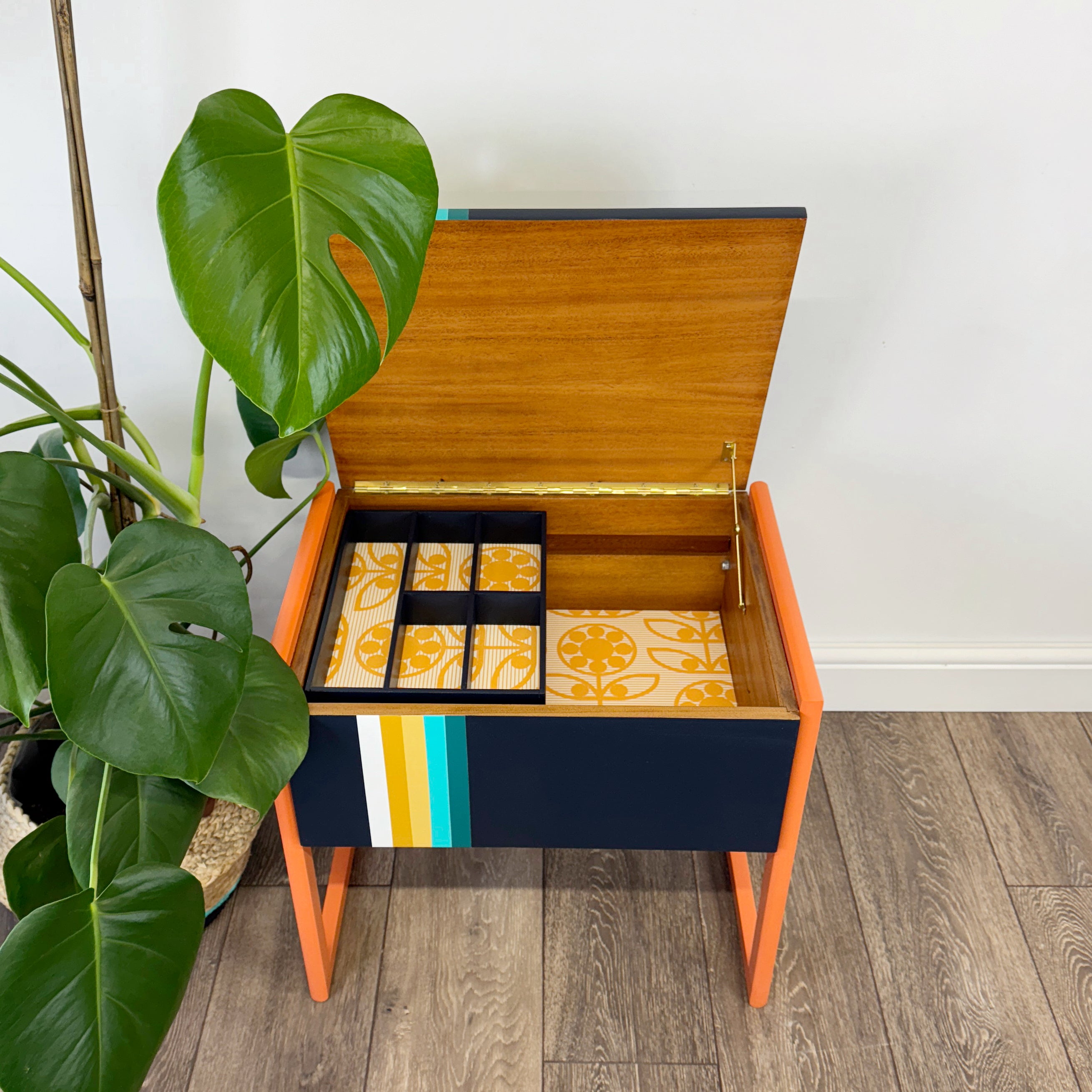 Retro sewing or crafters box painted in orange and blue stripe