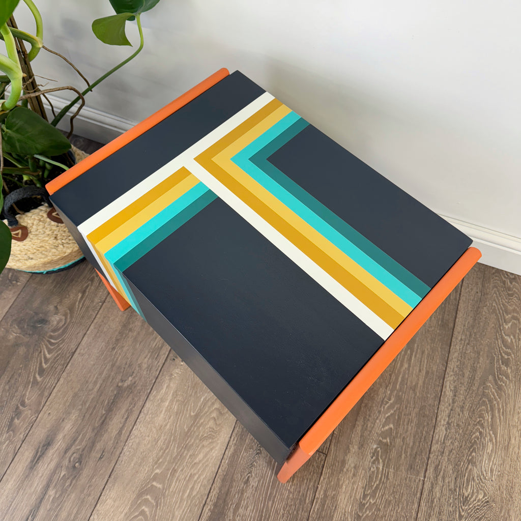 Retro sewing or crafters box painted in orange and blue stripe