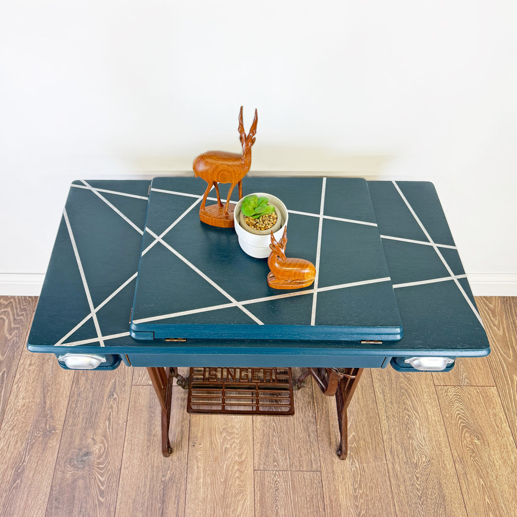 singer sewing machine table painted in blue with silver line design