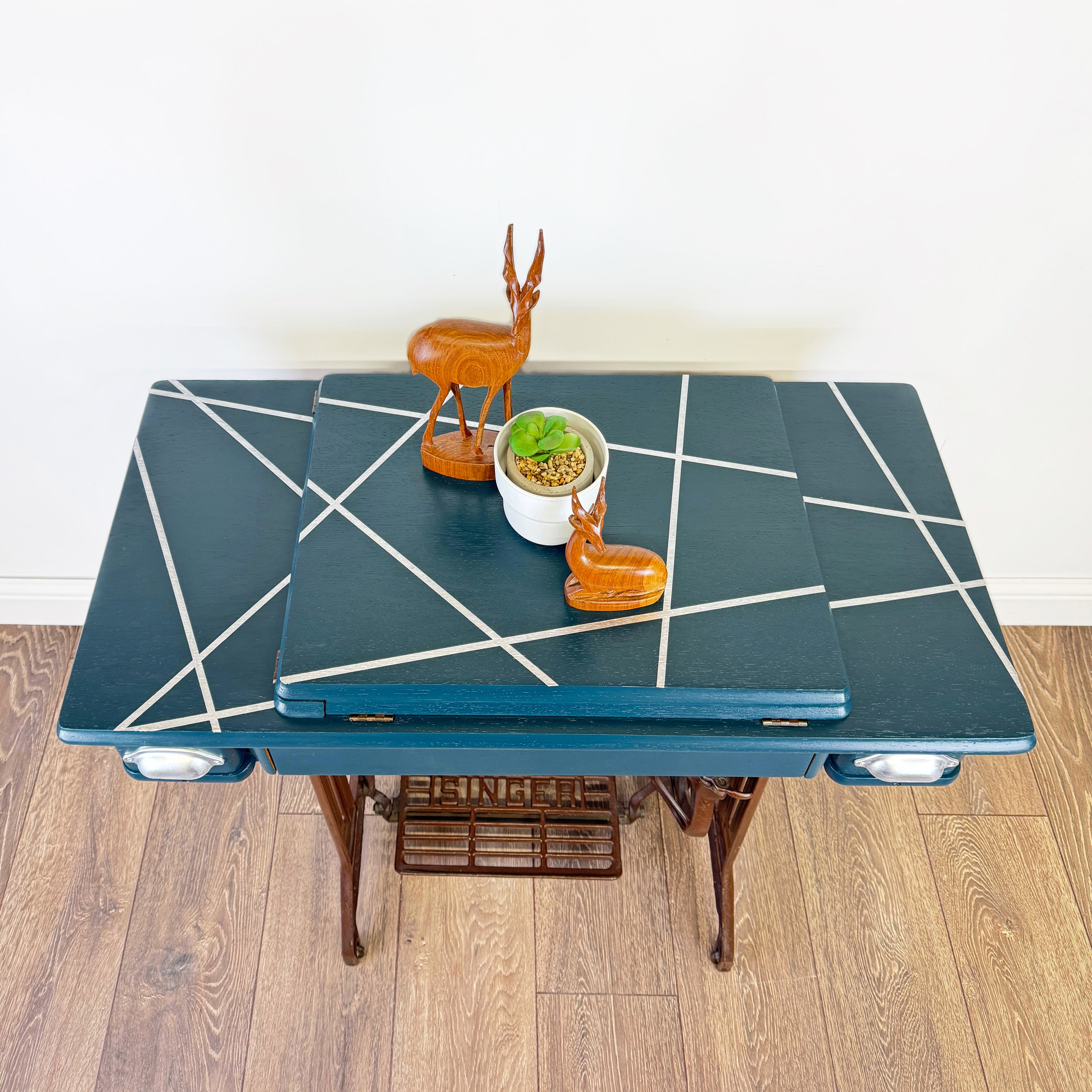singer sewing machine table painted in blue with silver line design