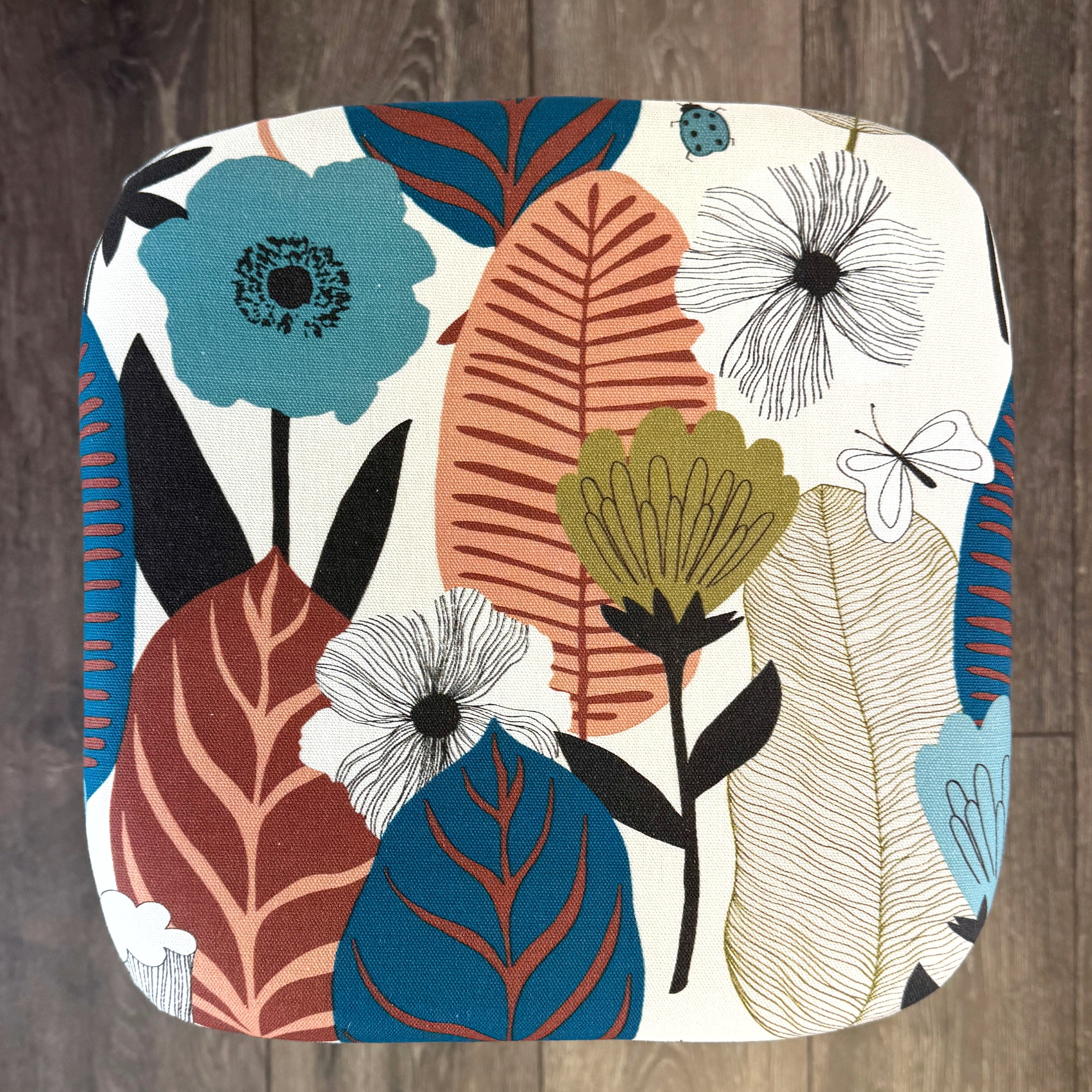 blue painted wooden stool with 1950s inspired flower fabric
