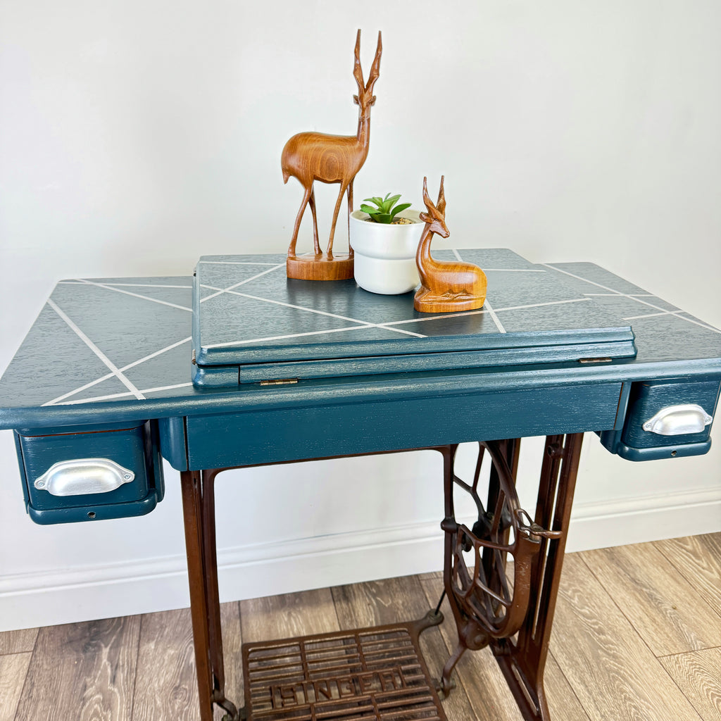 singer sewing machine table painted in blue with silver line design