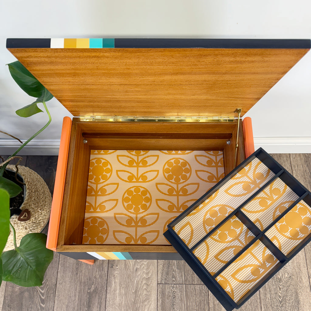 Retro sewing or crafters box painted in orange and blue stripe