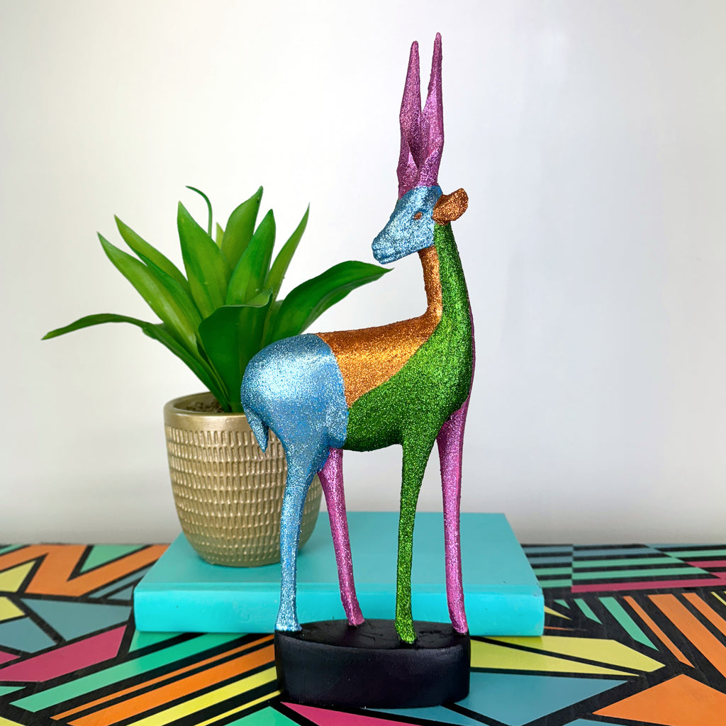 blue green and pink glitter painted wooden stag figurine