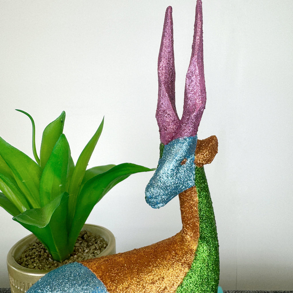 blue green and pink glitter painted wooden stag figurine
