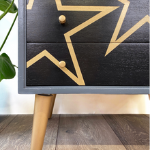 Load image into Gallery viewer, Grey and black upcycled mid century storage unit with handpaingted gold stars

