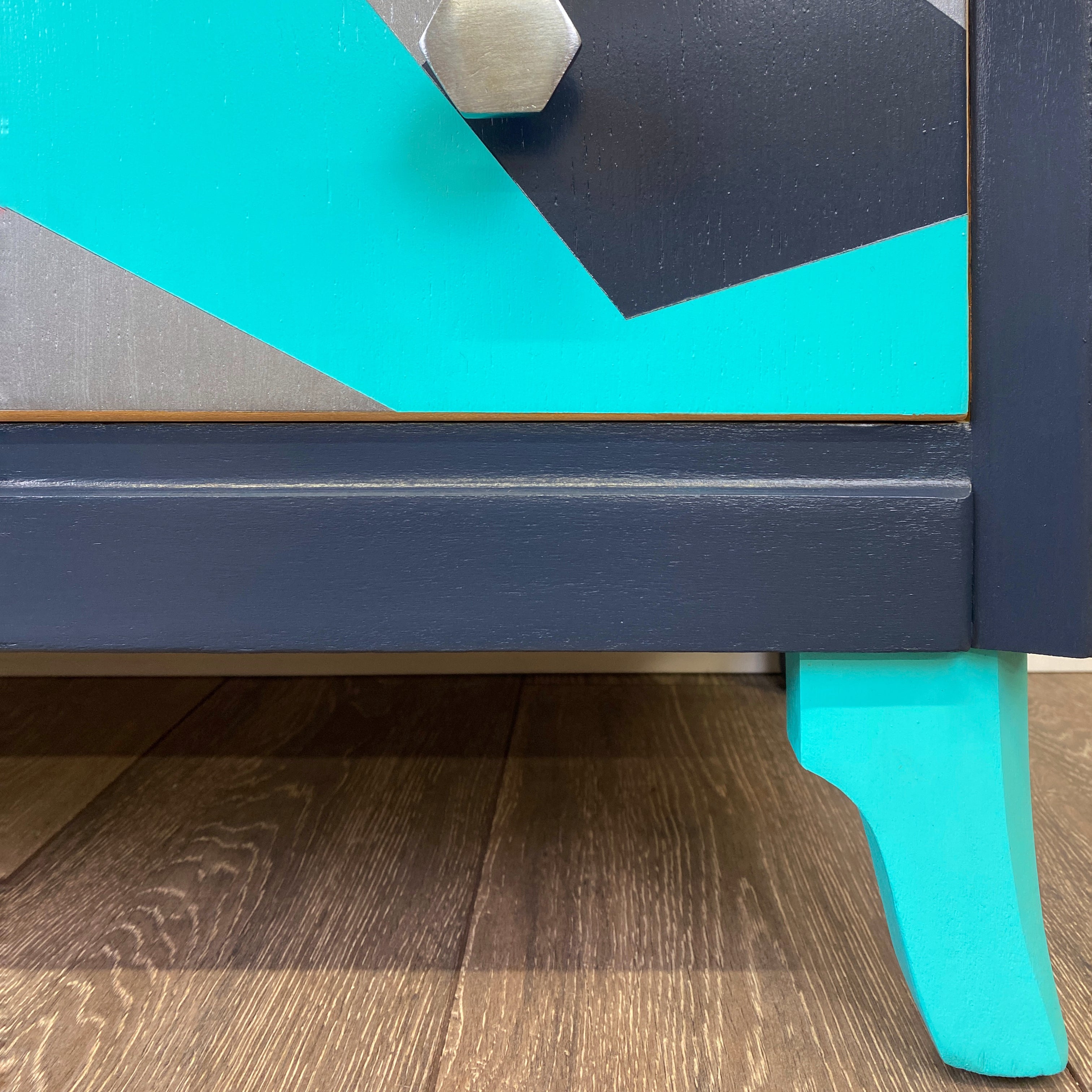 Upcyled painted lebsu mid century drawers with blue and silver geometric mountain pattern - close up of bright blue leg