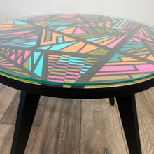 Load image into Gallery viewer, Round coffee table handpainted in bright colours and a geometric design
