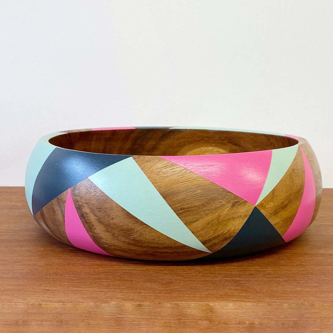 handpainted wooden bowl with triangular geometric design in blue, pink and teal
