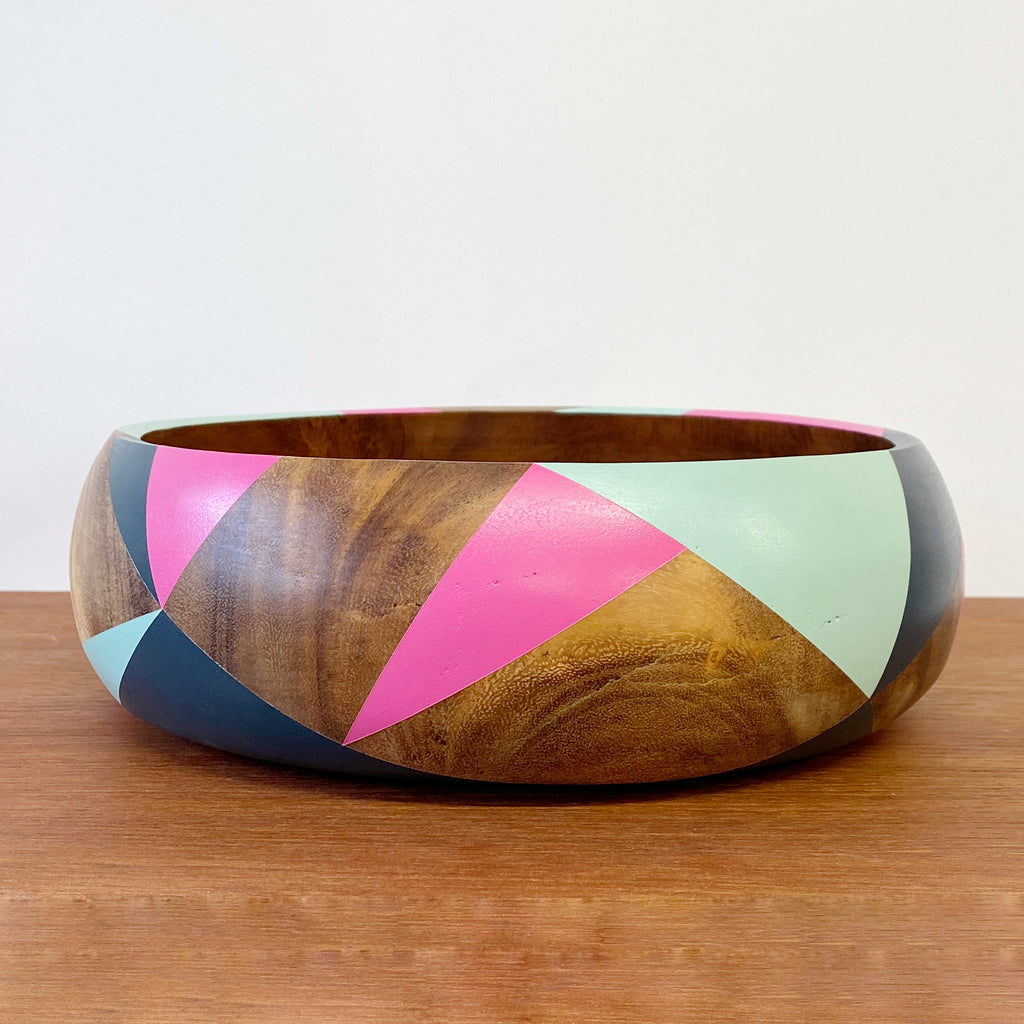 handpainted wooden bowl with triangular geometric design in blue, pink and teal